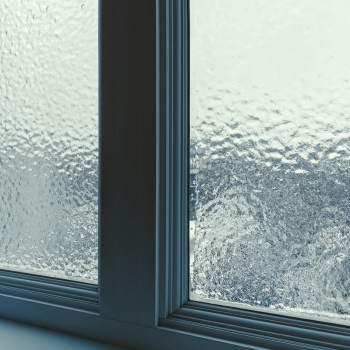 Frost forming across interior window glass during a hard Connecticut freeze