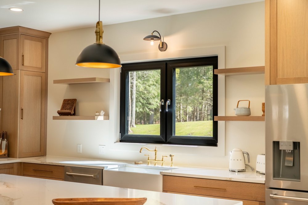 Kitchen with a black-framed Galaa window above the counter