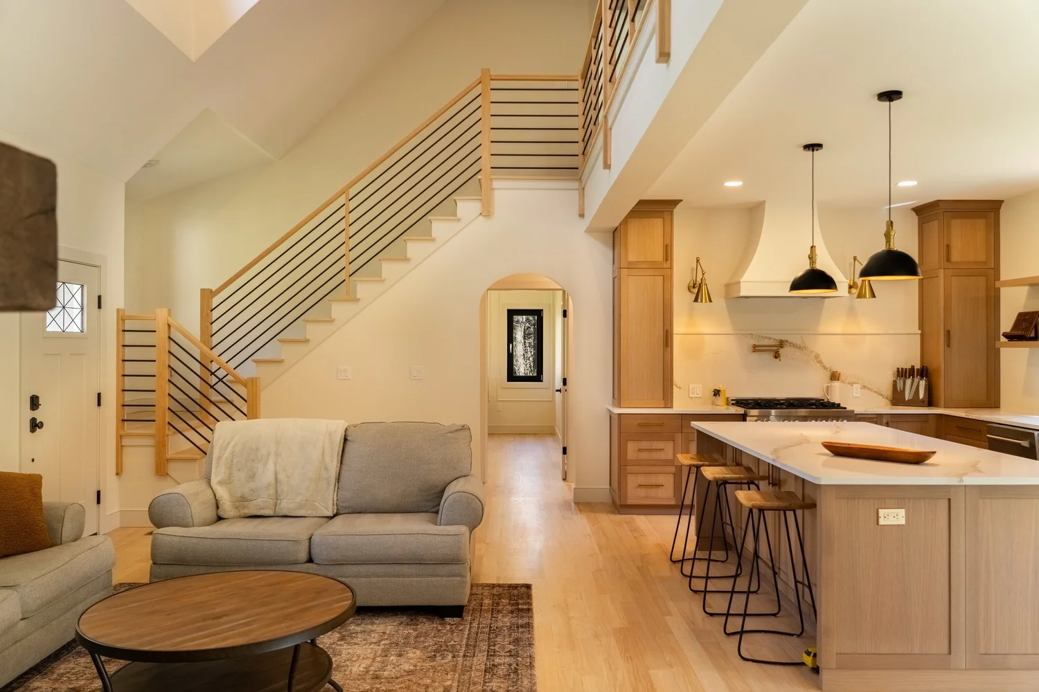 Open plan living room and kitchen with GALAA tilt-and-turn windows and doors
