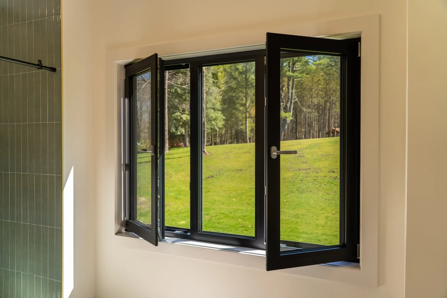GALAA tilt-and-turn sash turned open, showing the frame edge and perimeter gasket