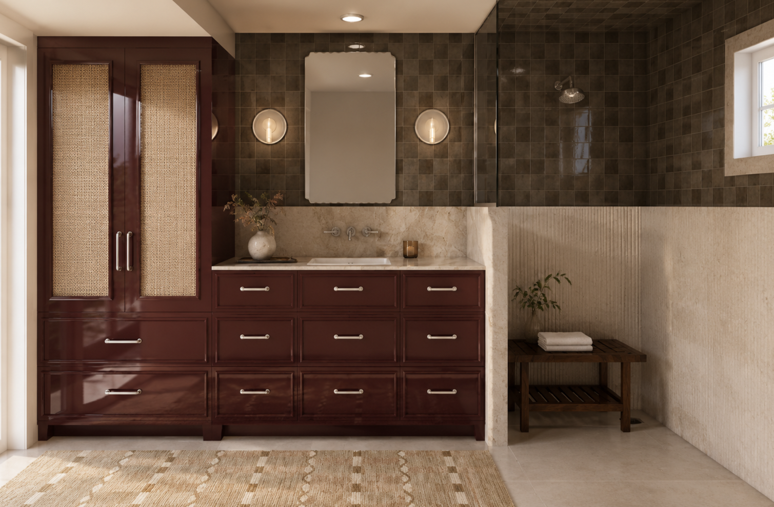 Bathroom vanity with dark wooden cabinets, beige marble countertop, and a large mirror. Two wall-mounted light fixtures and a small window on the right. A small potted plant and folded towels on a wooden bench in the corner.