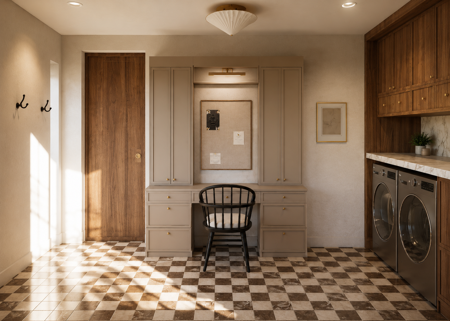A laundry room with a checkered tile floor, wooden cabinets, a gray vanity with a black chair, a framed bulletin board, and a washer and dryer. Sunlight streams in from the left.
