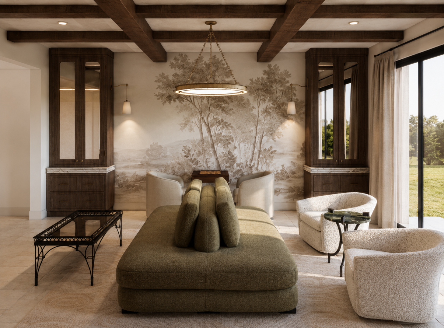 Living room with large window, ceiling with wooden beams, and a mural of trees on the wall. Features include a green ottoman, white armchairs, a glass-top coffee table, and a chandelier.