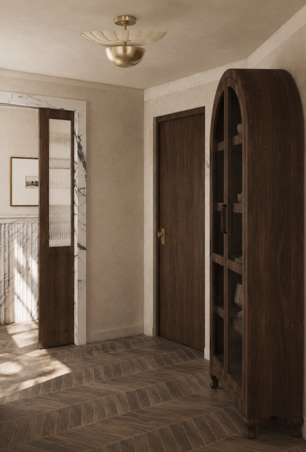 Interior corner of a room featuring a dark wooden cabinet with glass doors and a white ceiling light fixture. The walls are light-colored with beige textured finish, and the floor has a herringbone pattern of wood or wood-like tiles. An open door wit