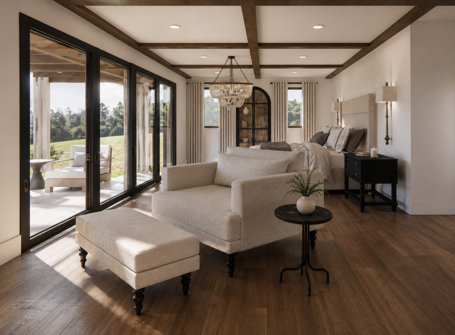 A modern bedroom with a large bed, black bedside table, and beige sofa facing large sliding glass doors that open to a patio overlooking a green landscape. The room features wooden ceiling beams, a chandelier, and a black bookshelf with decorative it