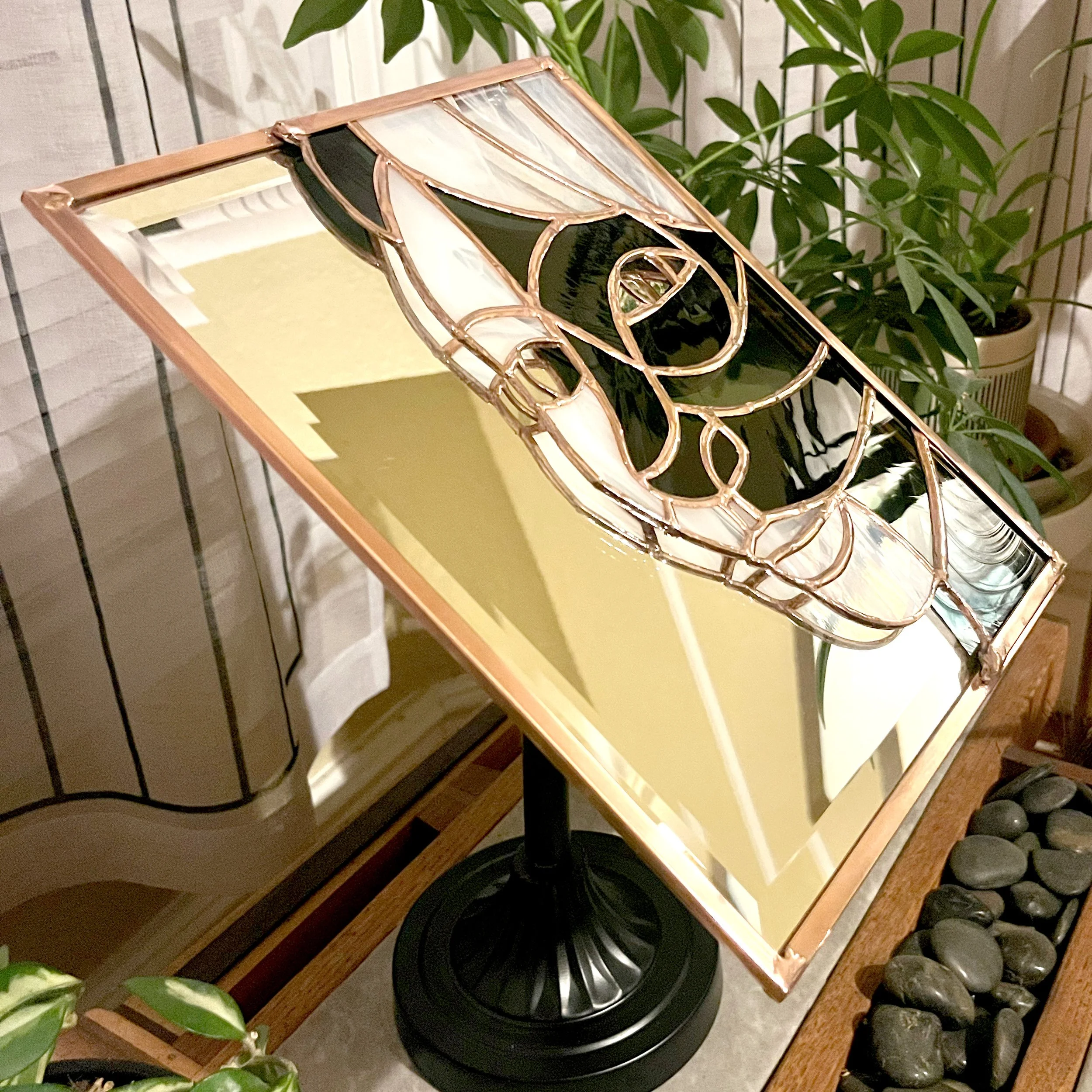 Alternate angle of stained glass portrait mounted on mirror