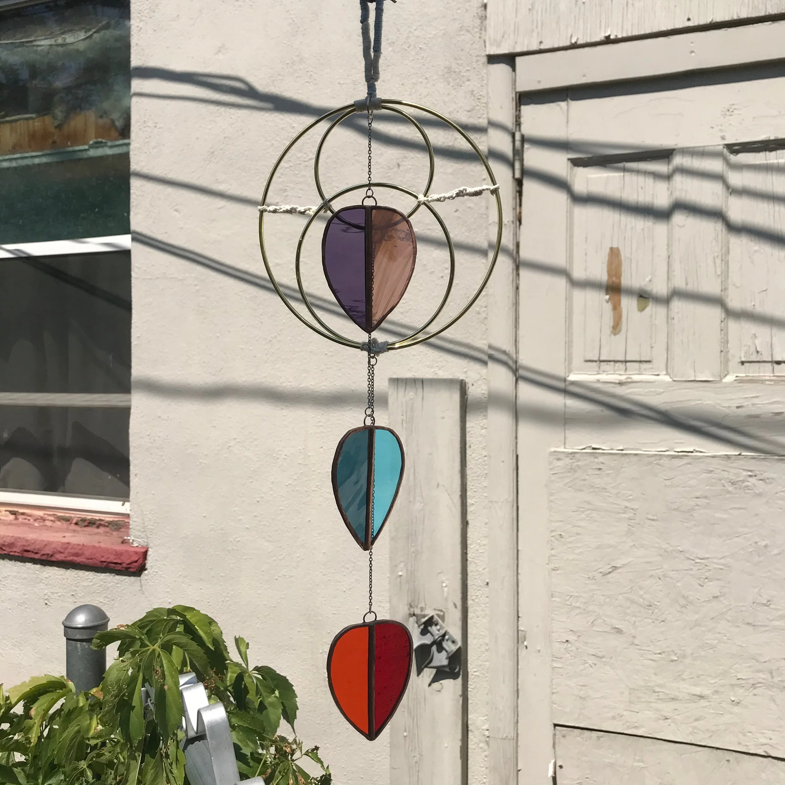 Three droplet stained glass pieces hanging from metal hoops