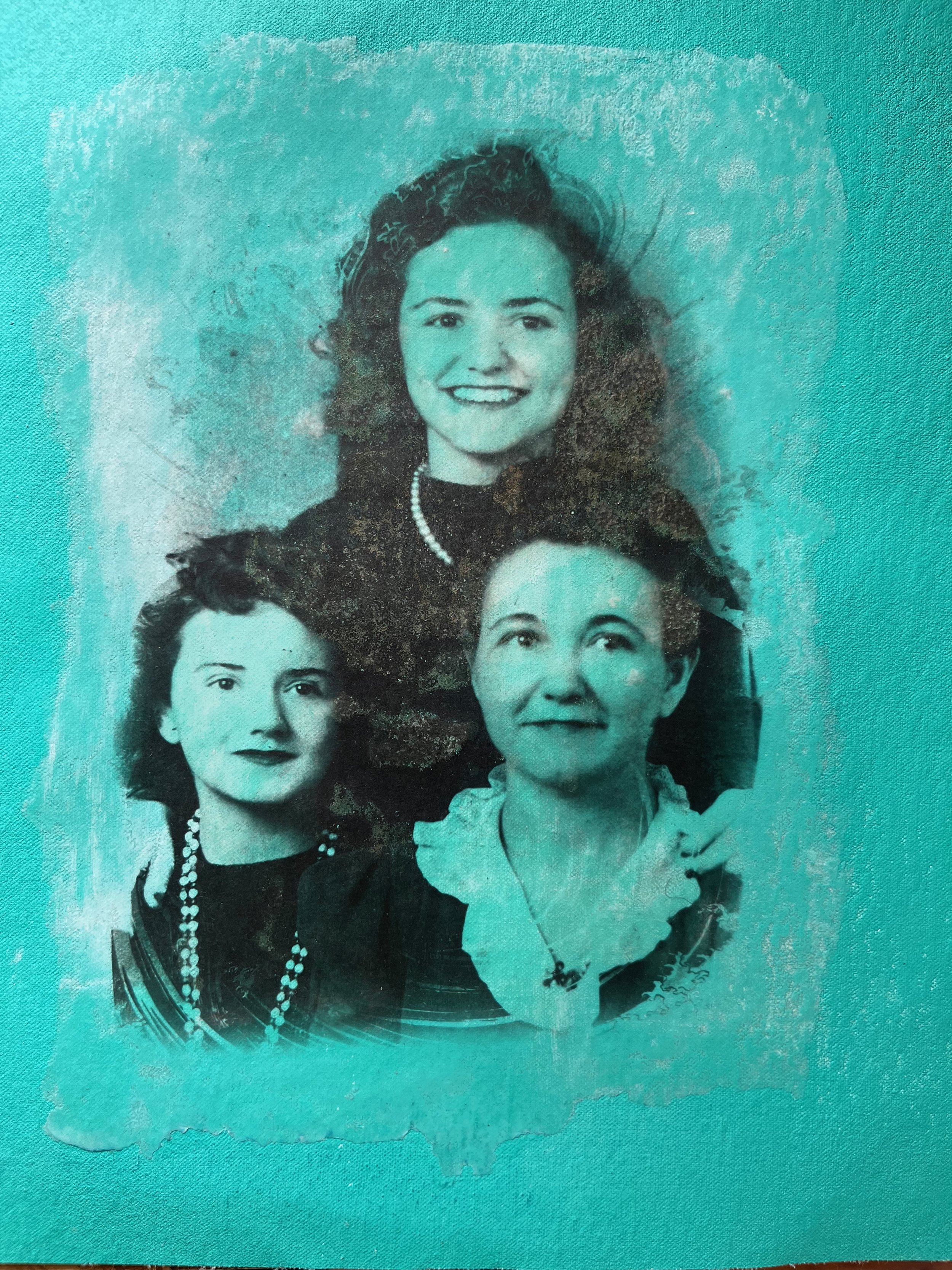 3 generations of women in dress clothes on green background