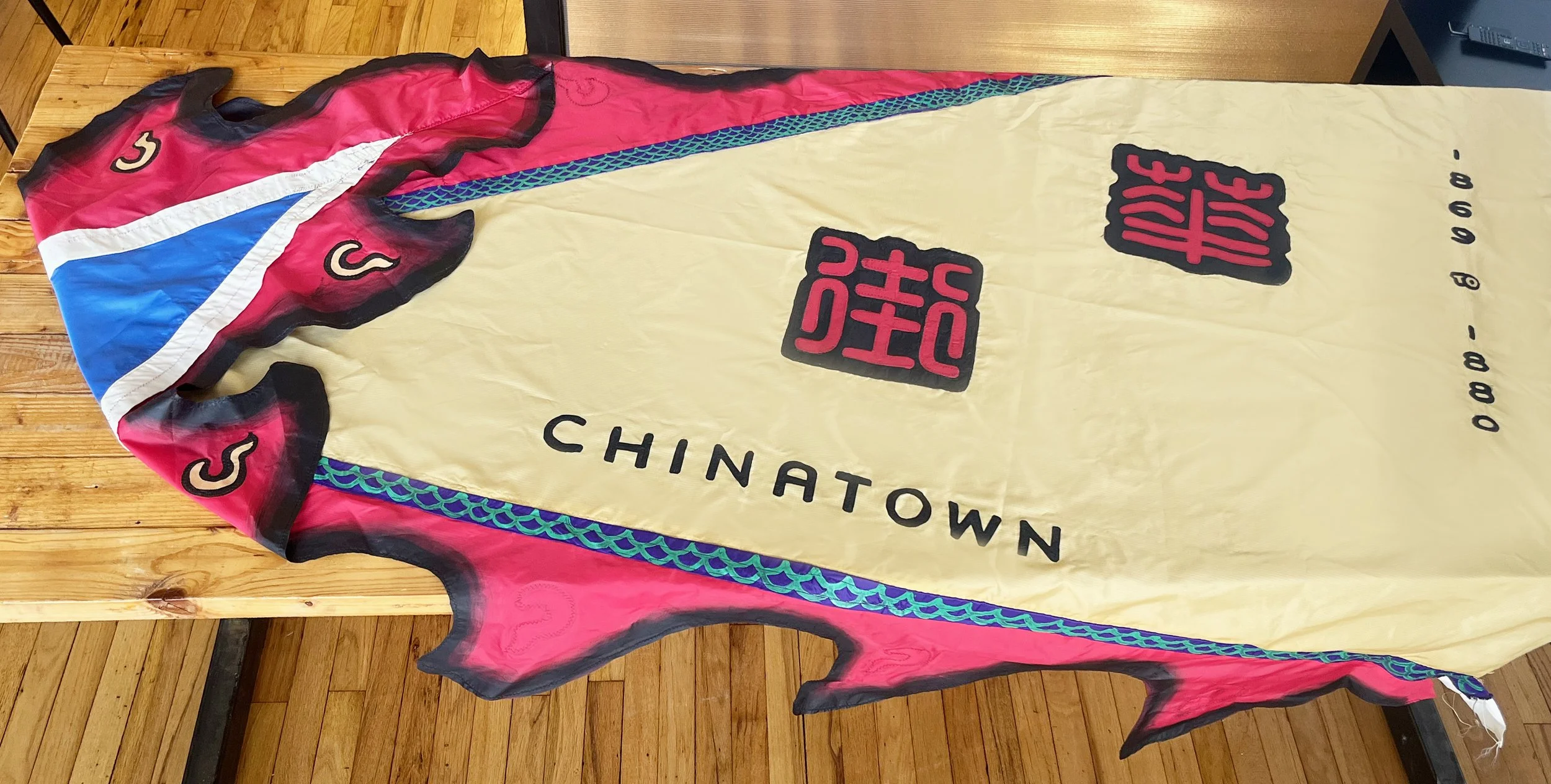 Opposite side close up of flag in English and Chinese