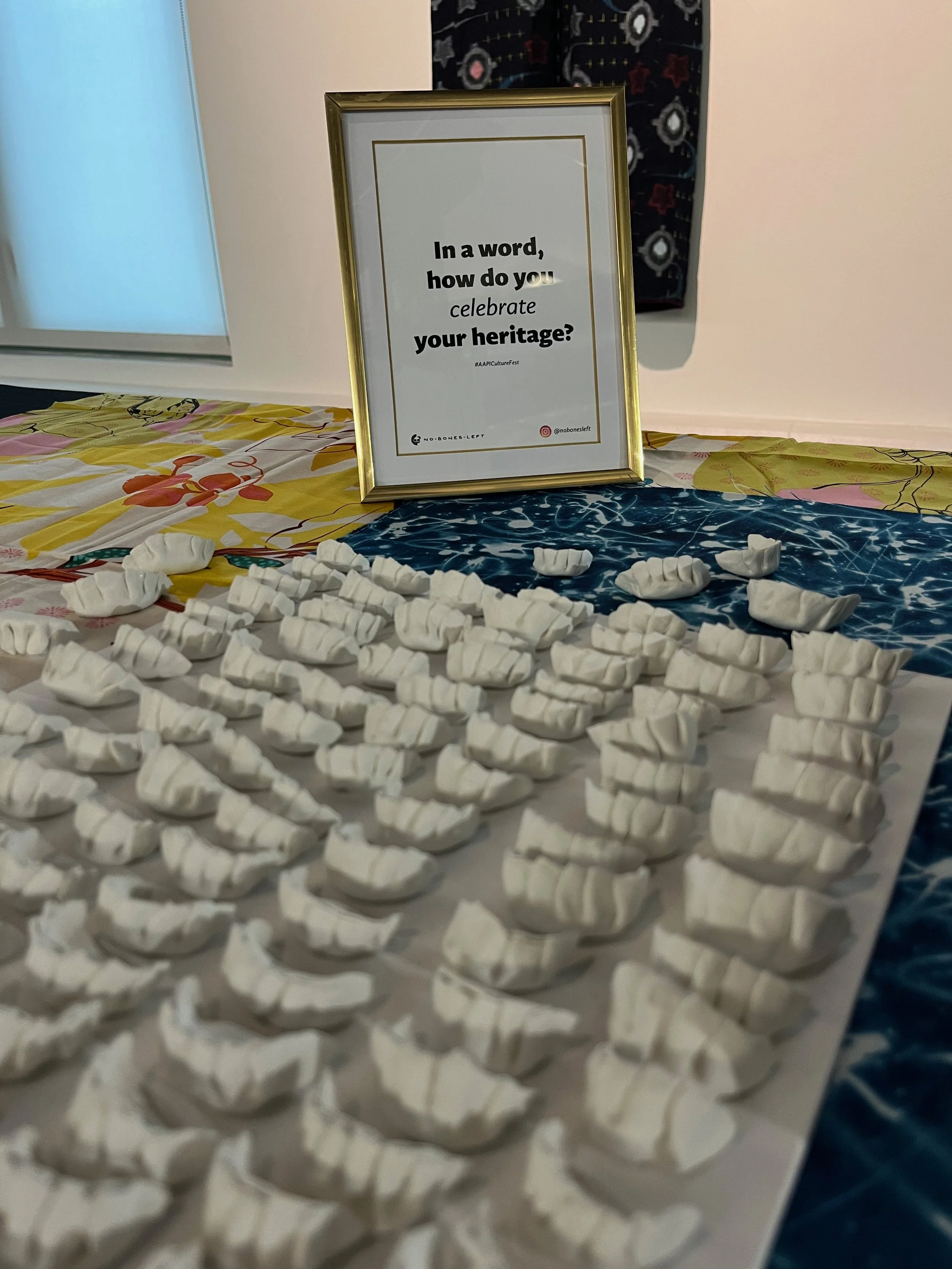 Close up image of project including frame with "In a word, how you celebrate your heritage" and blank dumplings