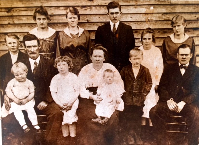 Image shows a large farm family in 1930 from Stone Mountain Georgia