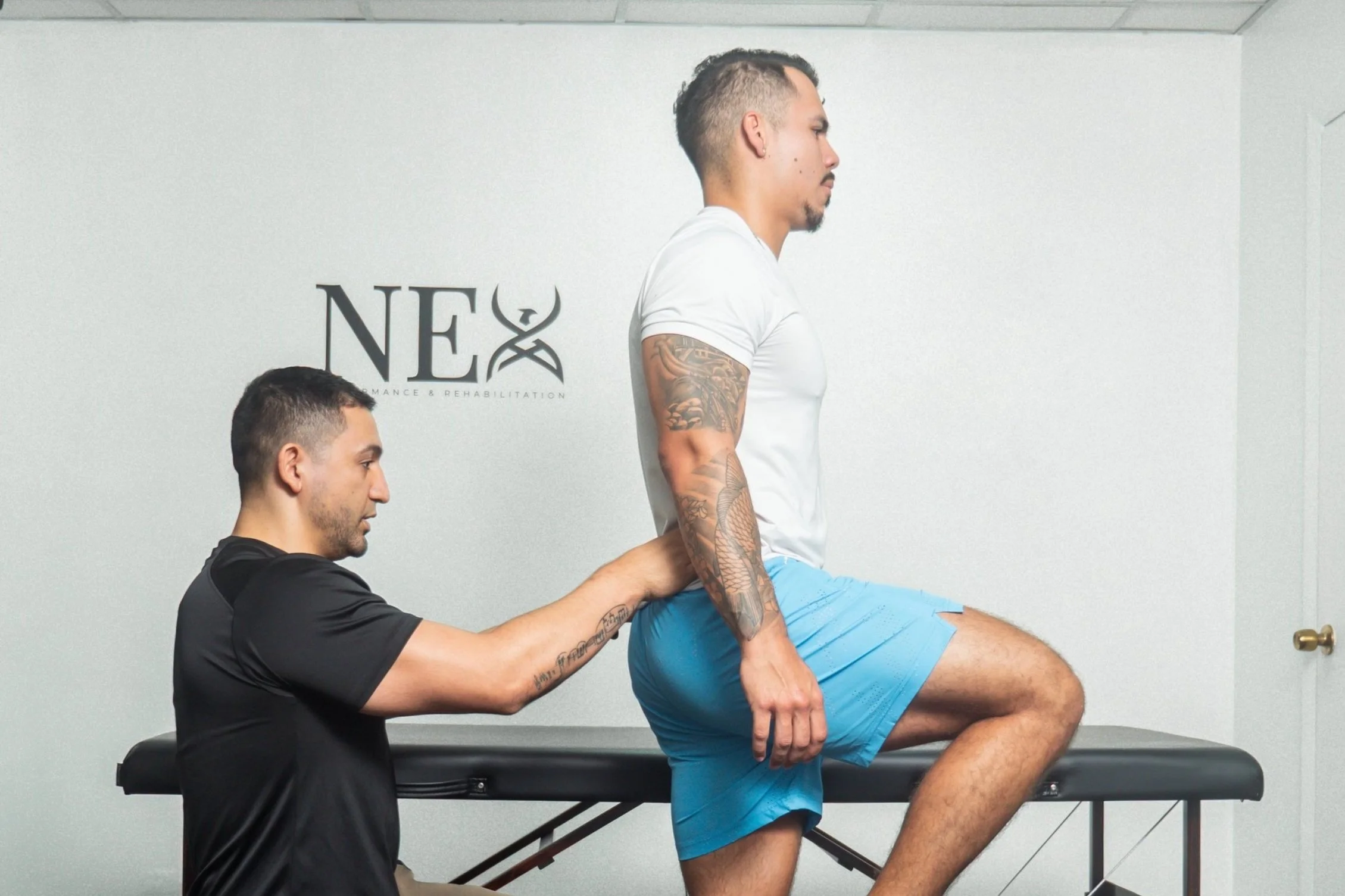 Dr. Felipe Suarez Castro, PT, DPT, CSCS. Physical Therapist and Strength and Performance Coach performing a physical evaluation for physical therapy and training services