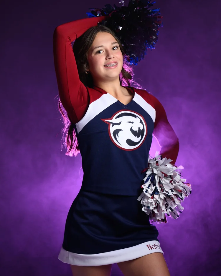 Competitive cheer athlete portrait in the studio