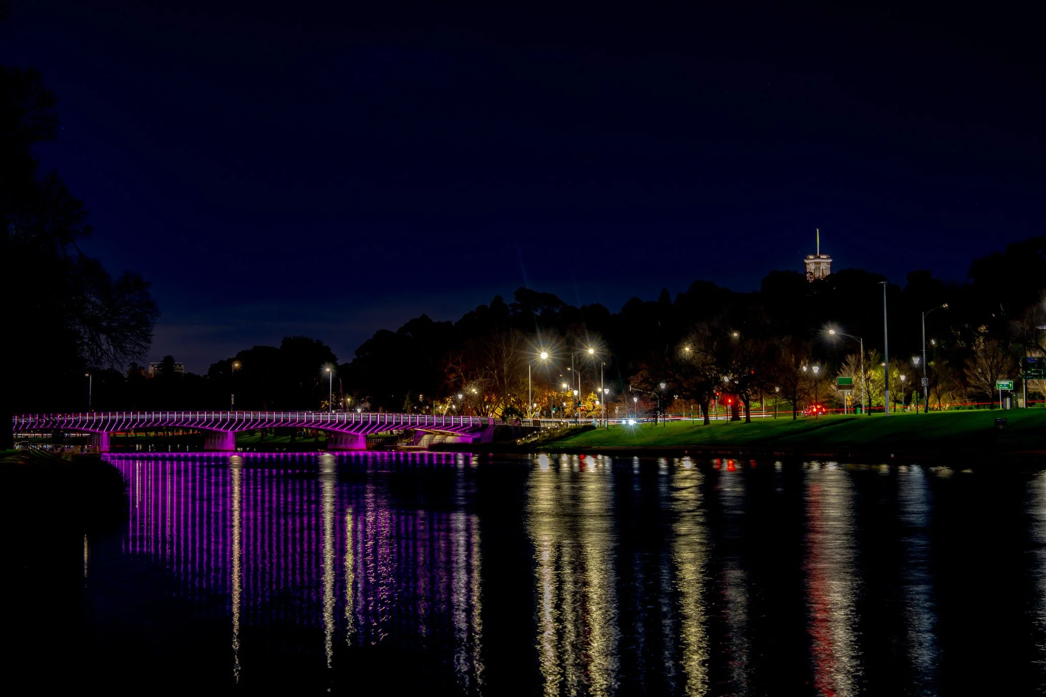 Swan Street Bridge glowing pink at night