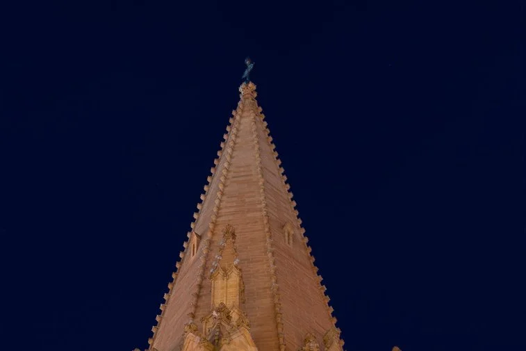 St Patrick Cathedral tower glowing in the night