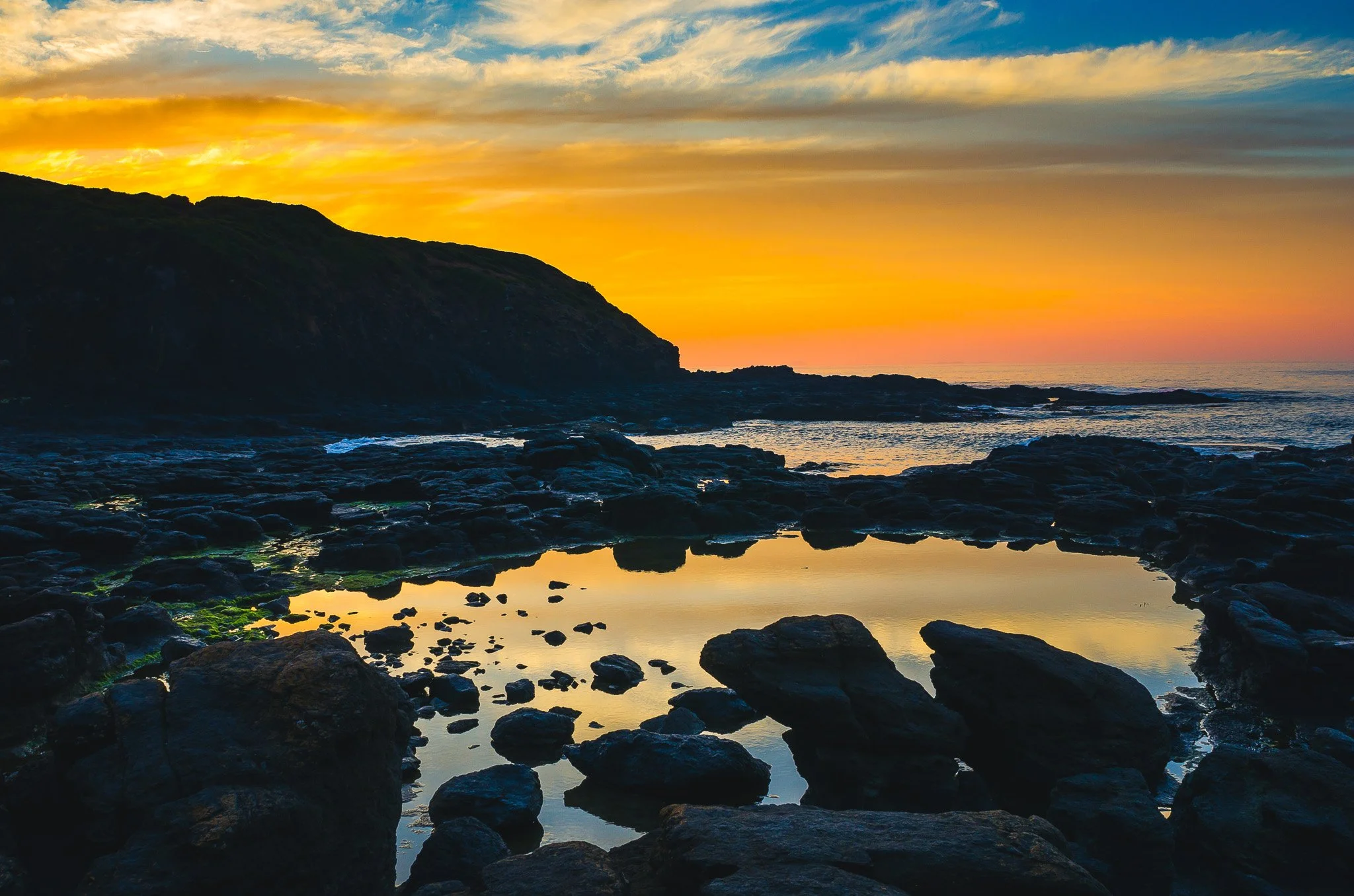 Rockpool reflects the sky at Flinders Blowhole