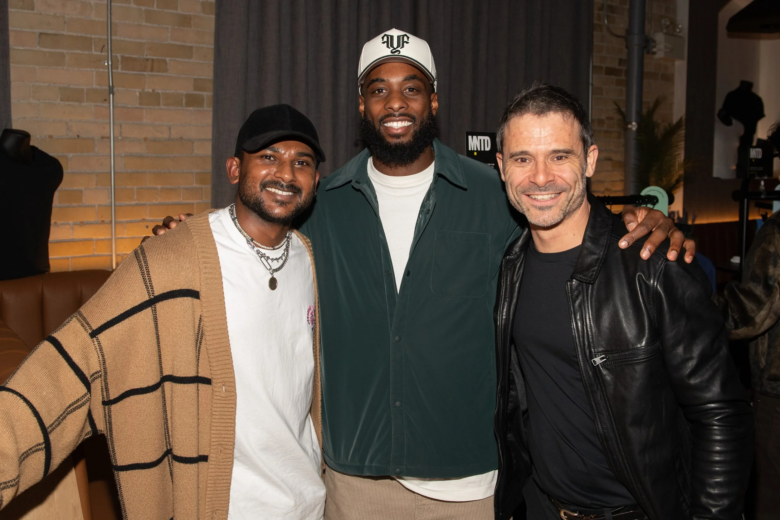 VIP guest Dejon Brisset of the Toronto Argonauts poses with two other male guests at the MNTD launch event hosted by Public/Realm lifestyle PR agency; Public/Realm is an expert at curating people and events