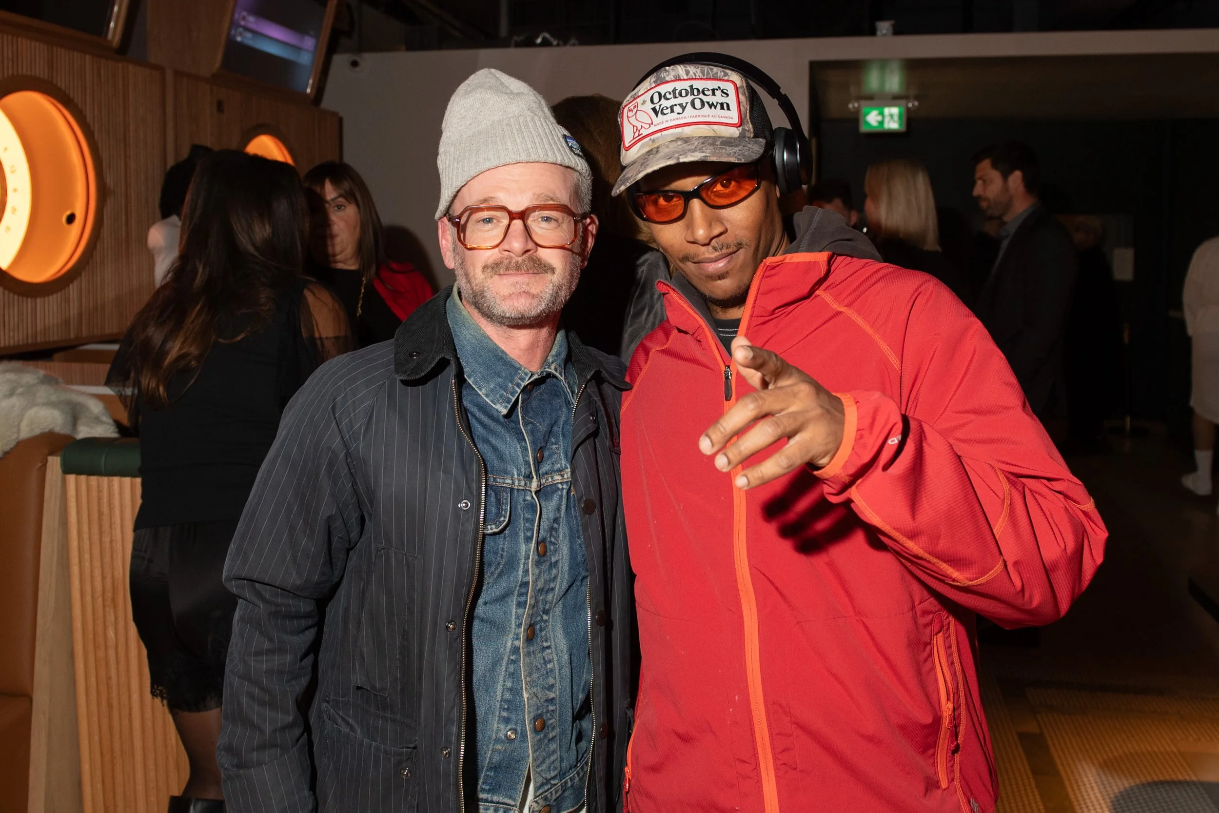 VIP guests, Shayne Stephens and David Forteau pose for a photo at the MNTD Launch Event hosted by Public/Realm; David is pointing at the camera with a smile on his face while Shayne leans in