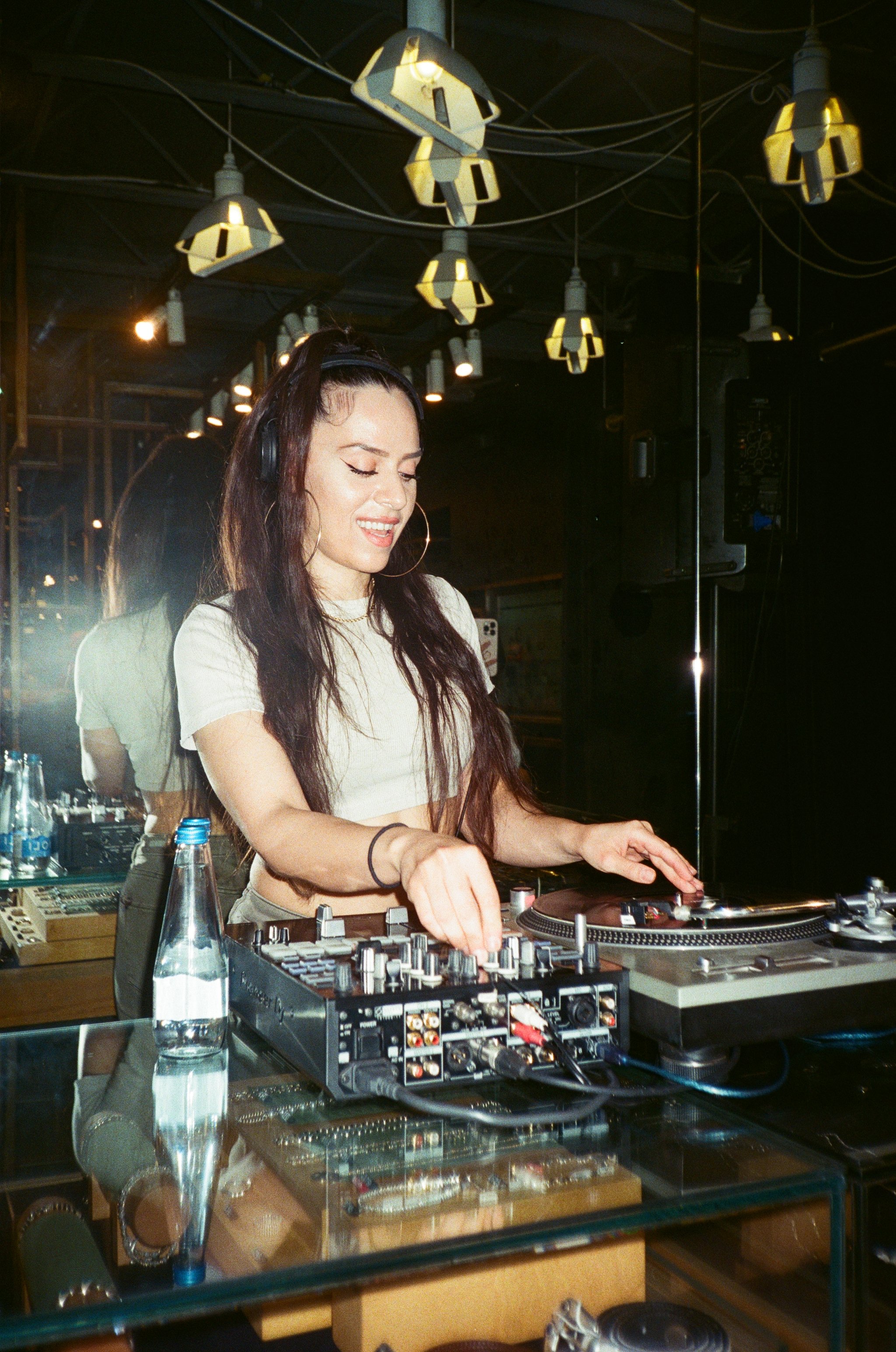 A DJ creating the ambiance during the Adidas Y-3 x Due West in-store tastemaker event.