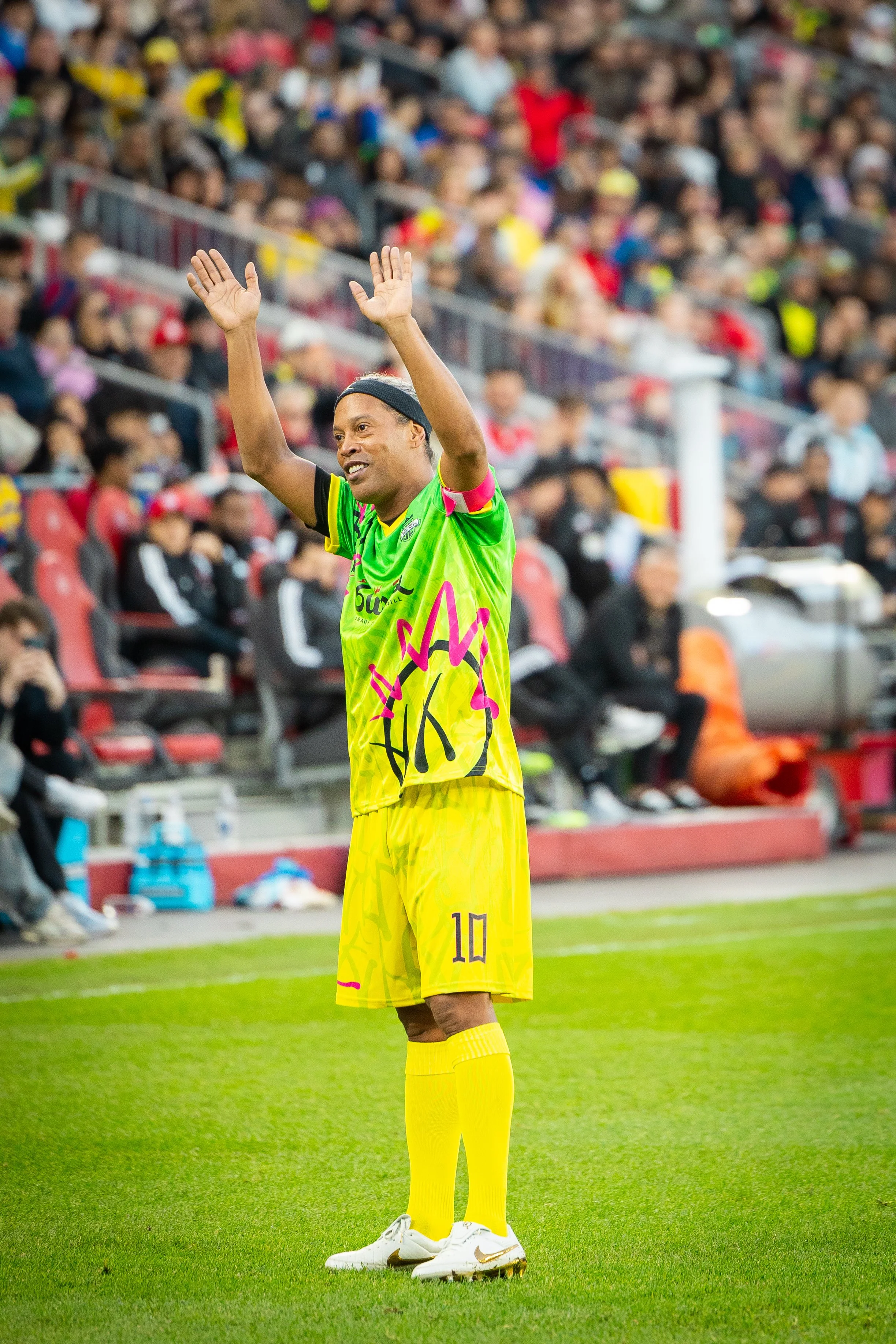 Brazilian soccer legend Ronaldinho waves to his fans at BMO Field during the Living Legends match