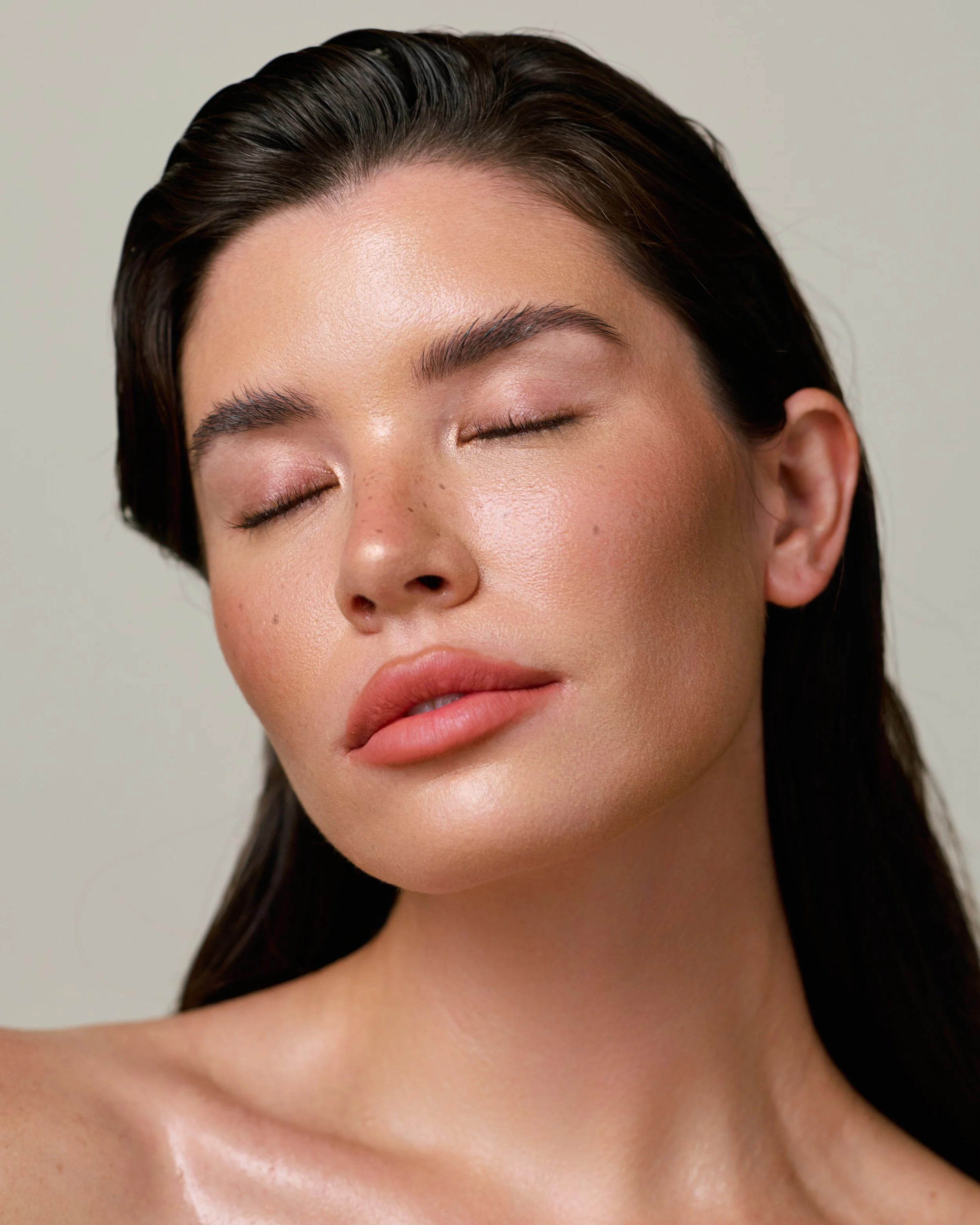 Beauty photography in Los Angeles: eyes closed, natural dewy skin, by Moises Martinez