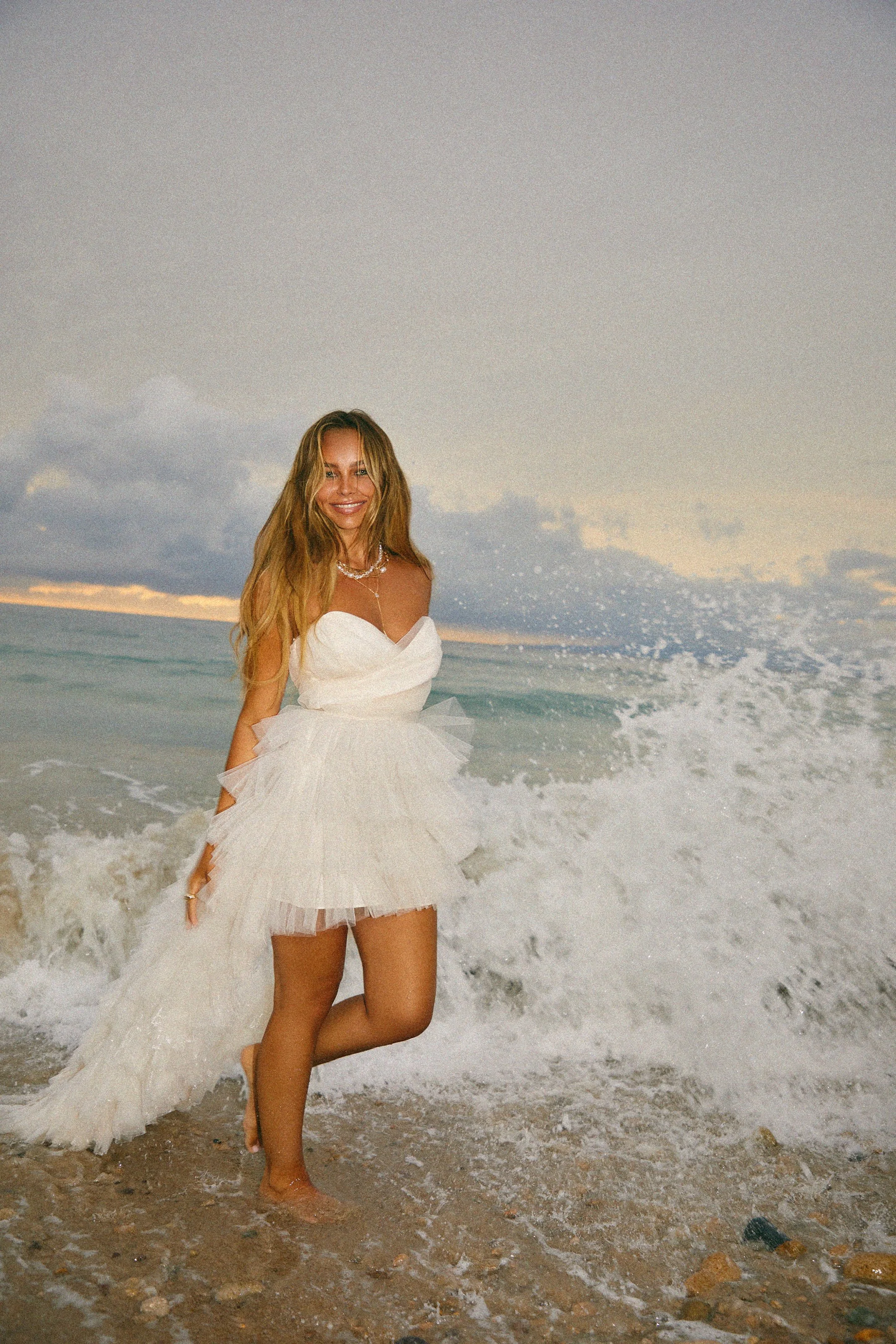 Fashion photography in Los Angeles: white tulle dress in crashing waves, by Moises Martinez