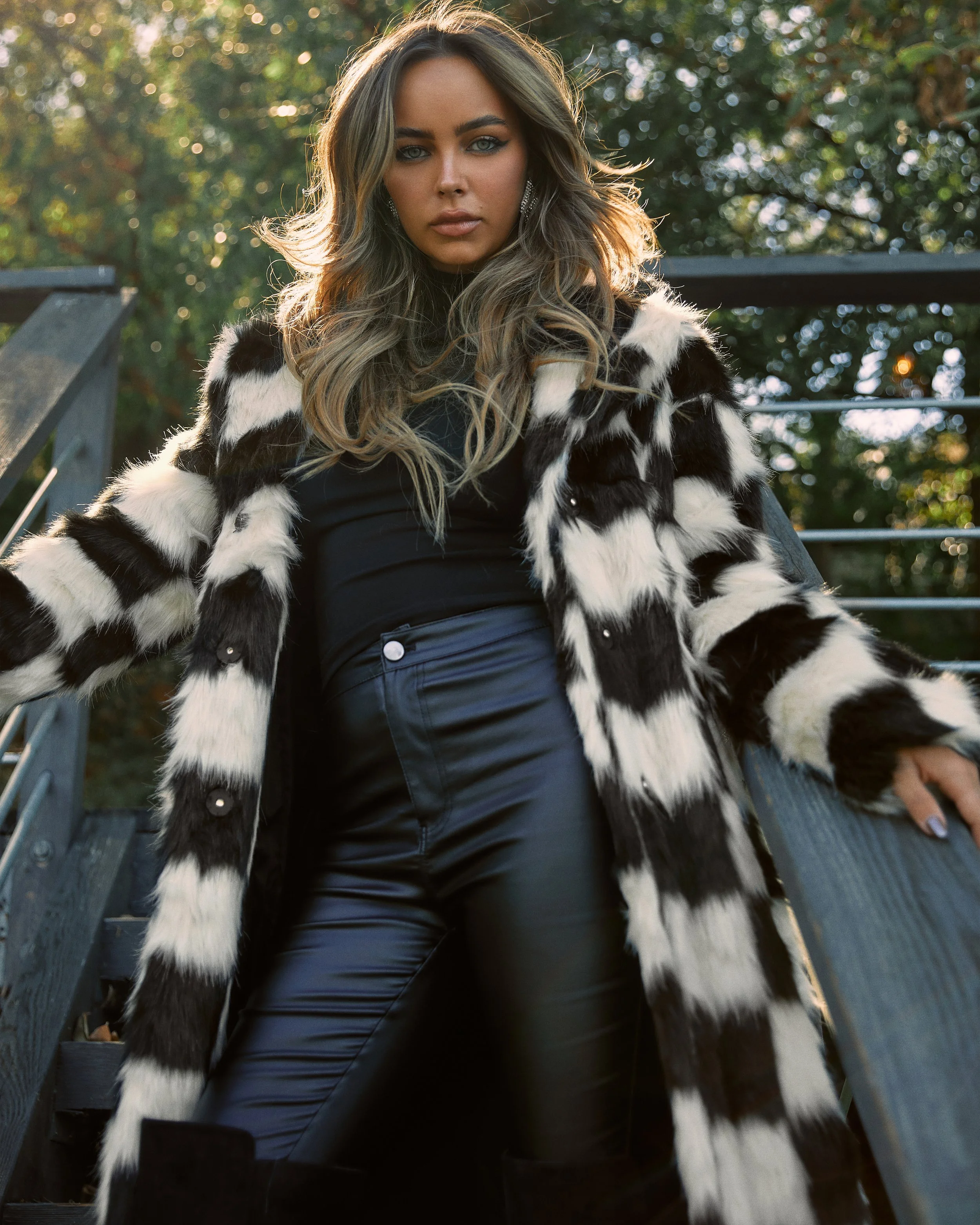 Fashion photography in Los Angeles: black and white checkered coat outdoors, by Moises Martinez