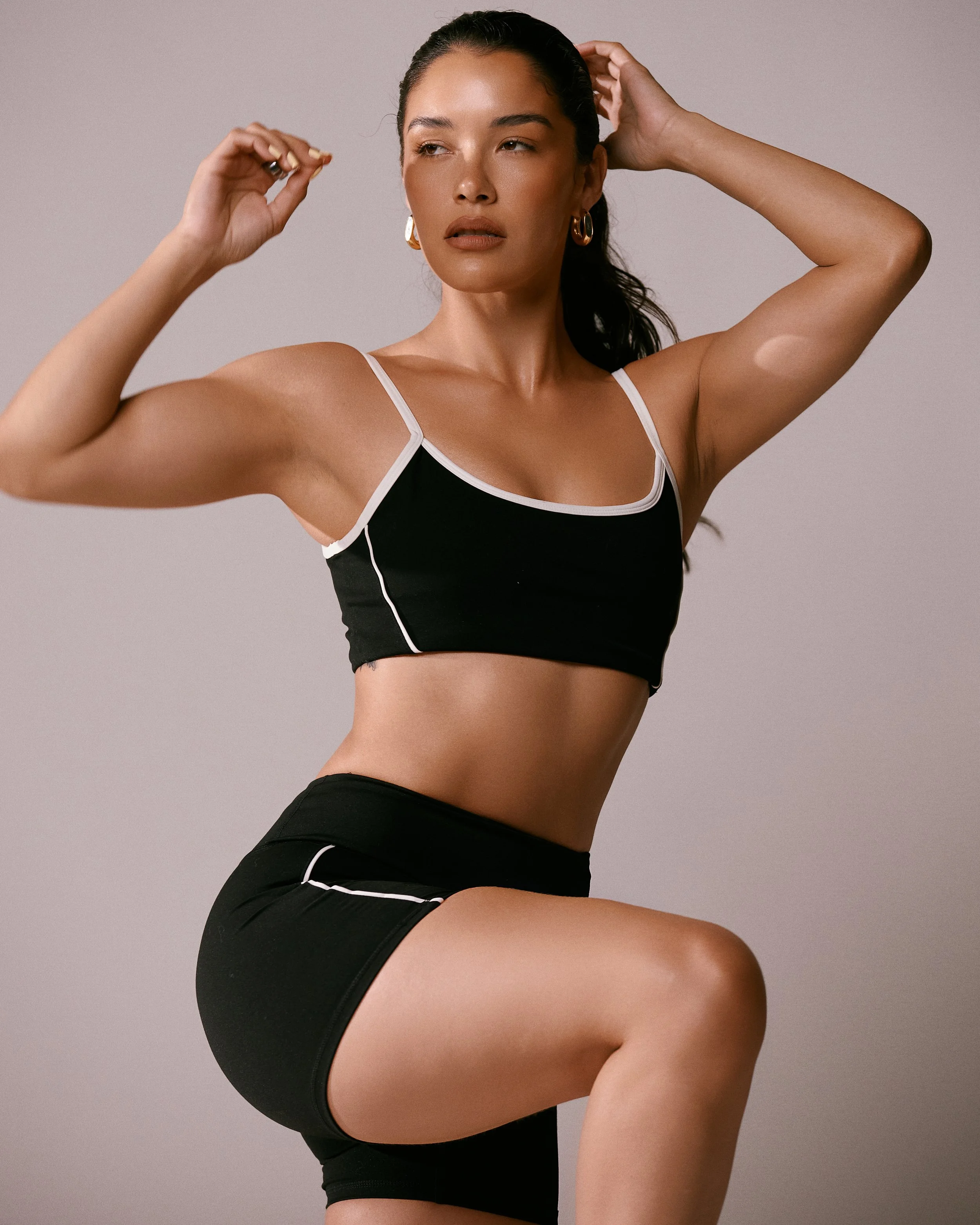 Activewear photography in Los Angeles: black sports bra and shorts in the studio, by Moises Martinez