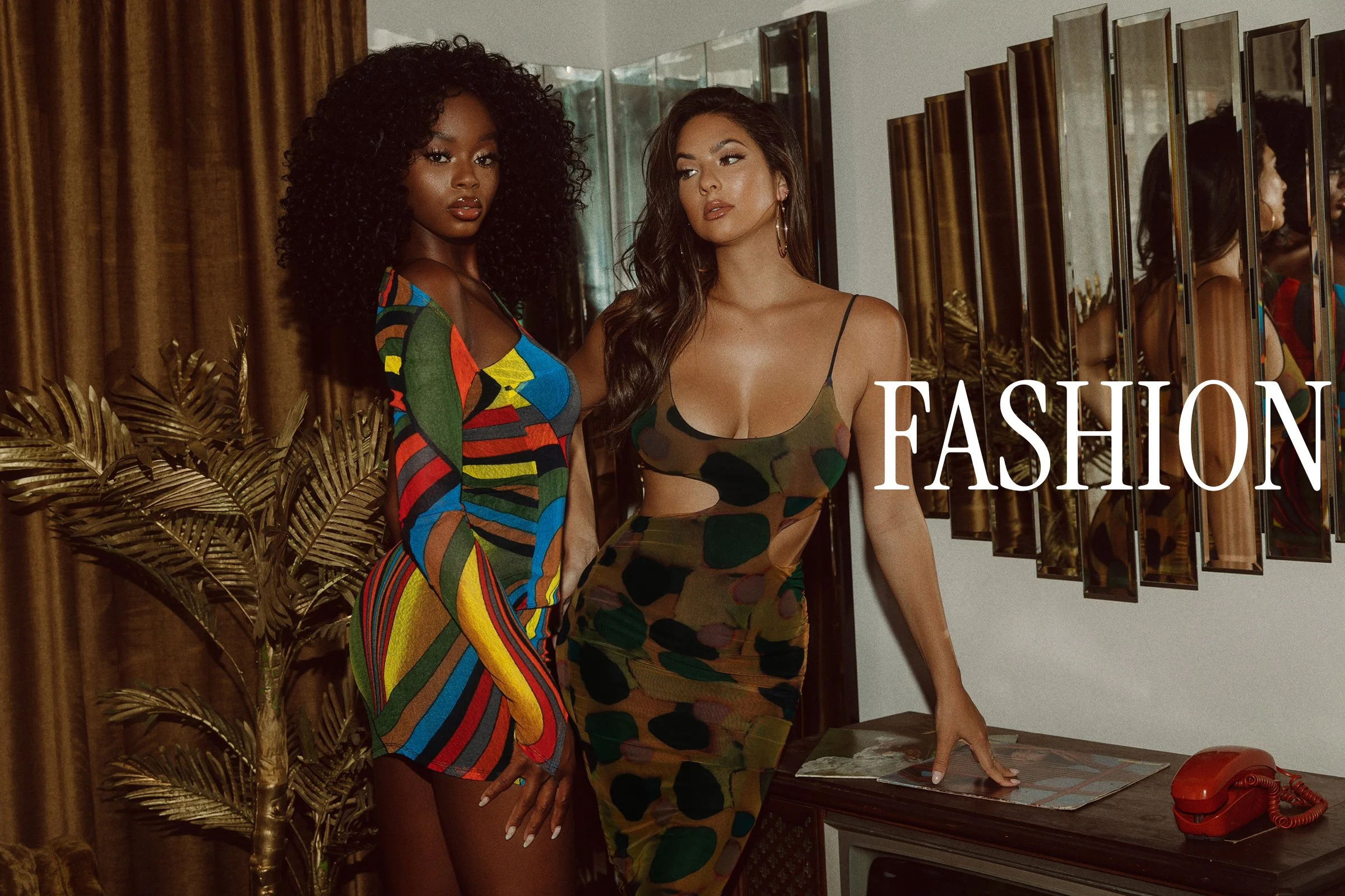 Fashion photography in Los Angeles: two models in printed dresses in a retro set, by Moises Martinez
