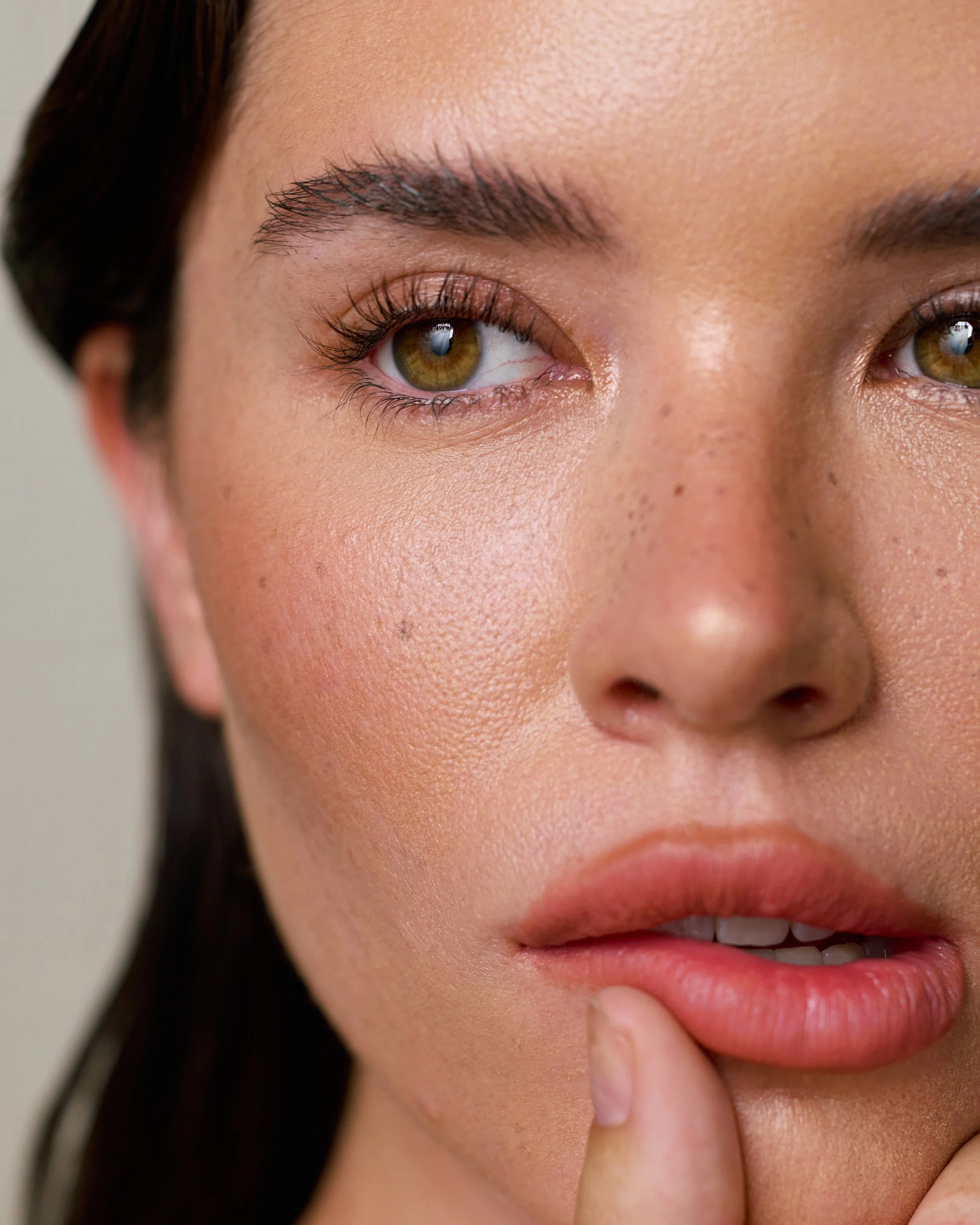 Beauty photography in Los Angeles: macro close-up of eyes and lips with natural skin, by Moises Martinez