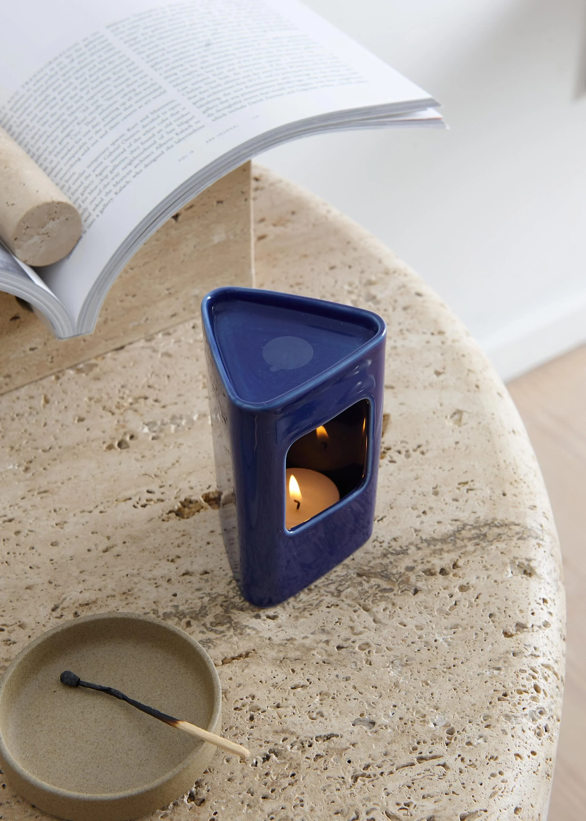 This glossy, triangular, blue porcelain incense burner is easy to clean.