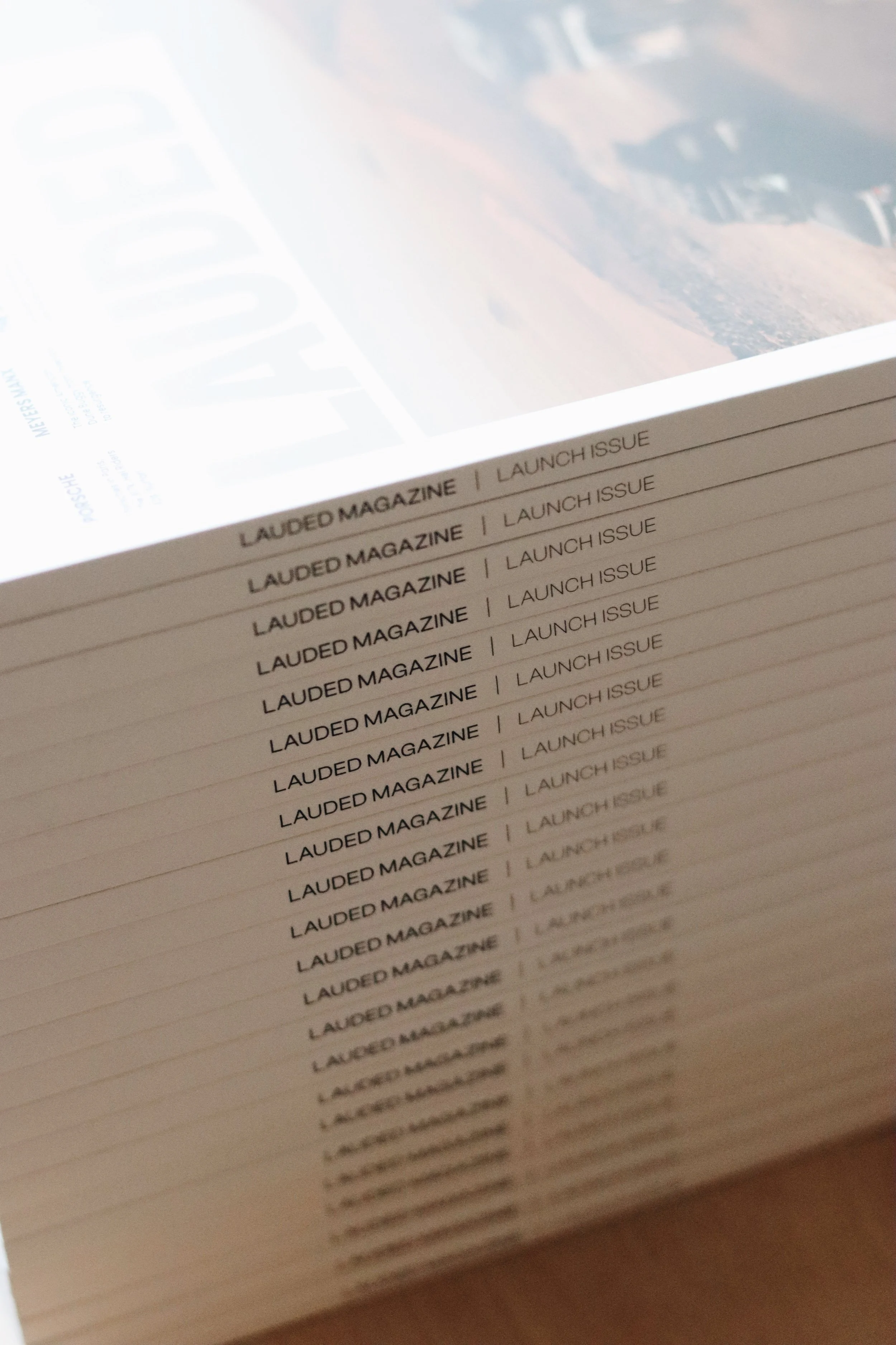 Close-up of the page with the words 'Lauded Magazine' and 'Launch Issue' repeated in a list.