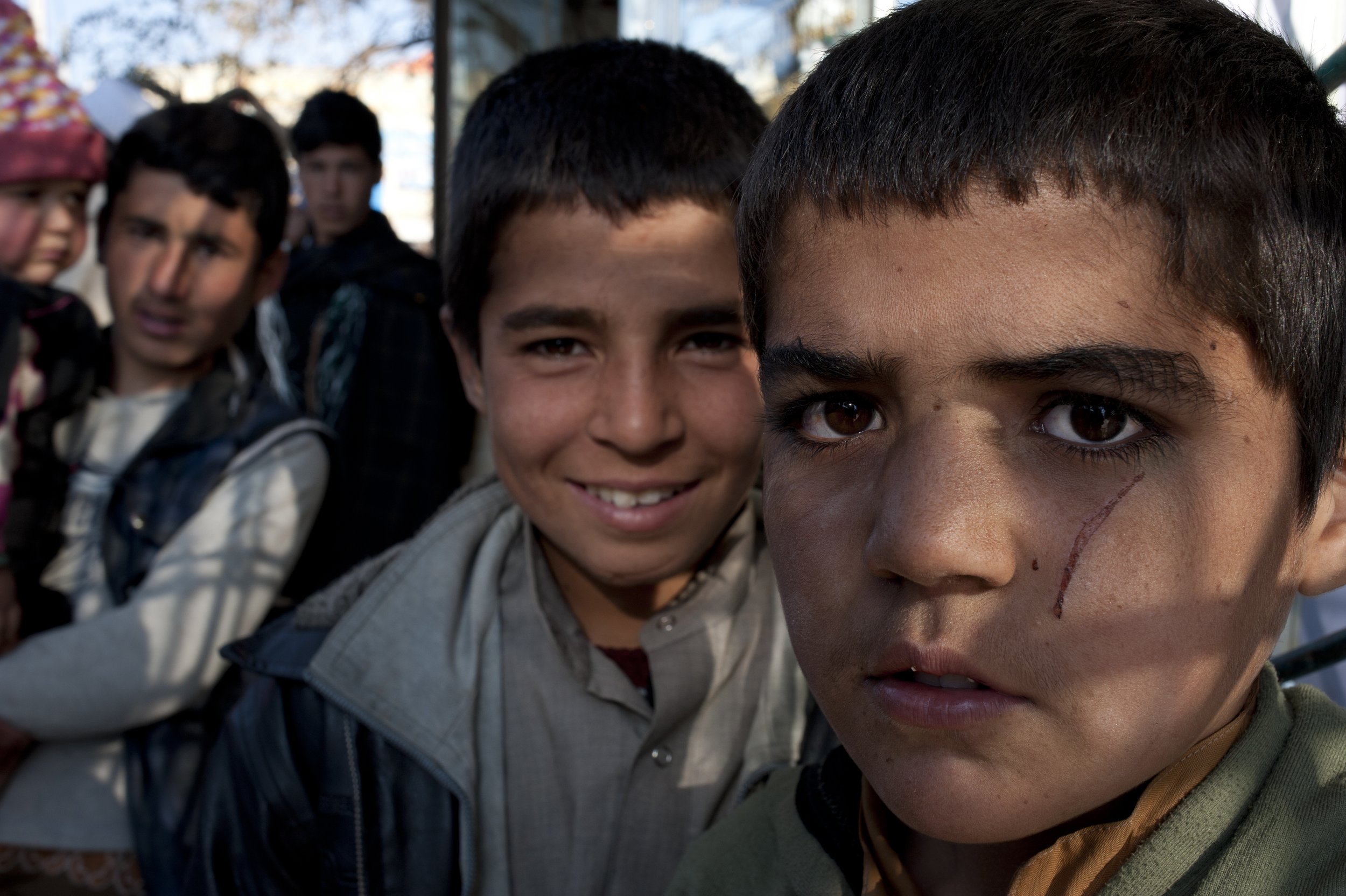 Young Heratis, Herat 2012 Boys in front of the Blue Mosque. These boys work as a shoe cleaners sell socks.