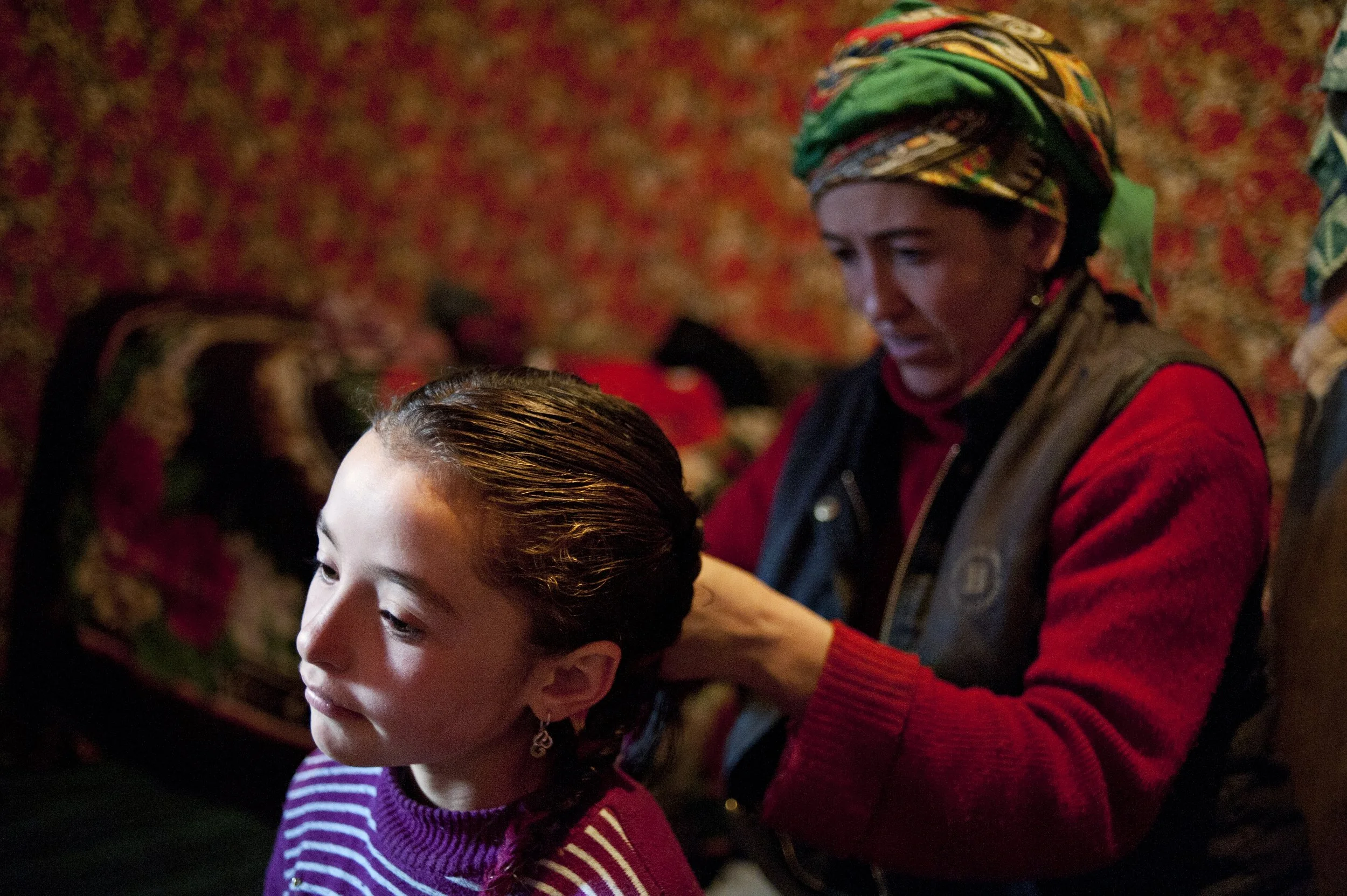 After the bath mum arranges Gulguna’s braids. Children are loved here because they are a blessing of God.