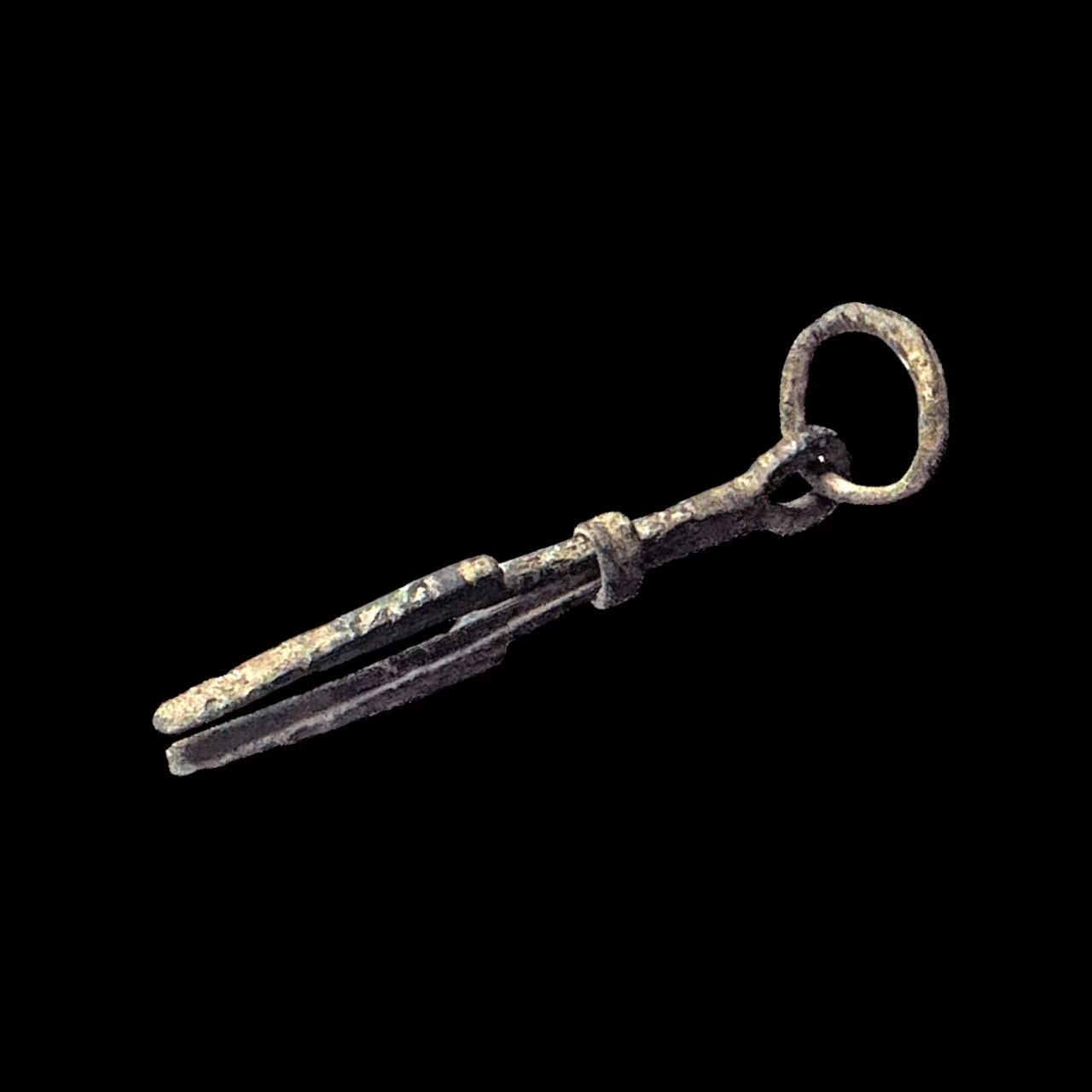 Old, rusty key on black background.