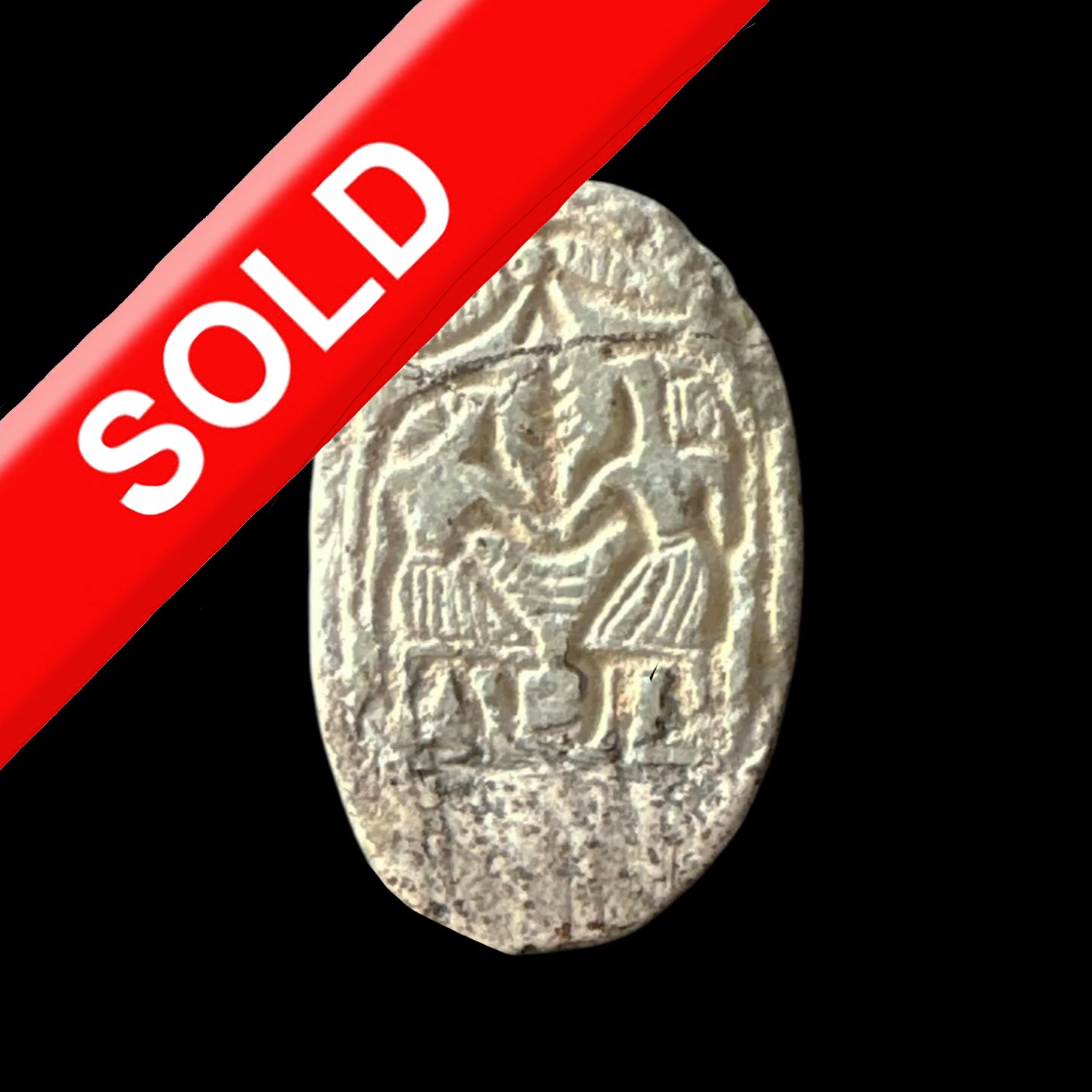Ancient coin with engraved human figures and symbols, marked with a red banner labeled 'SOLD'.
