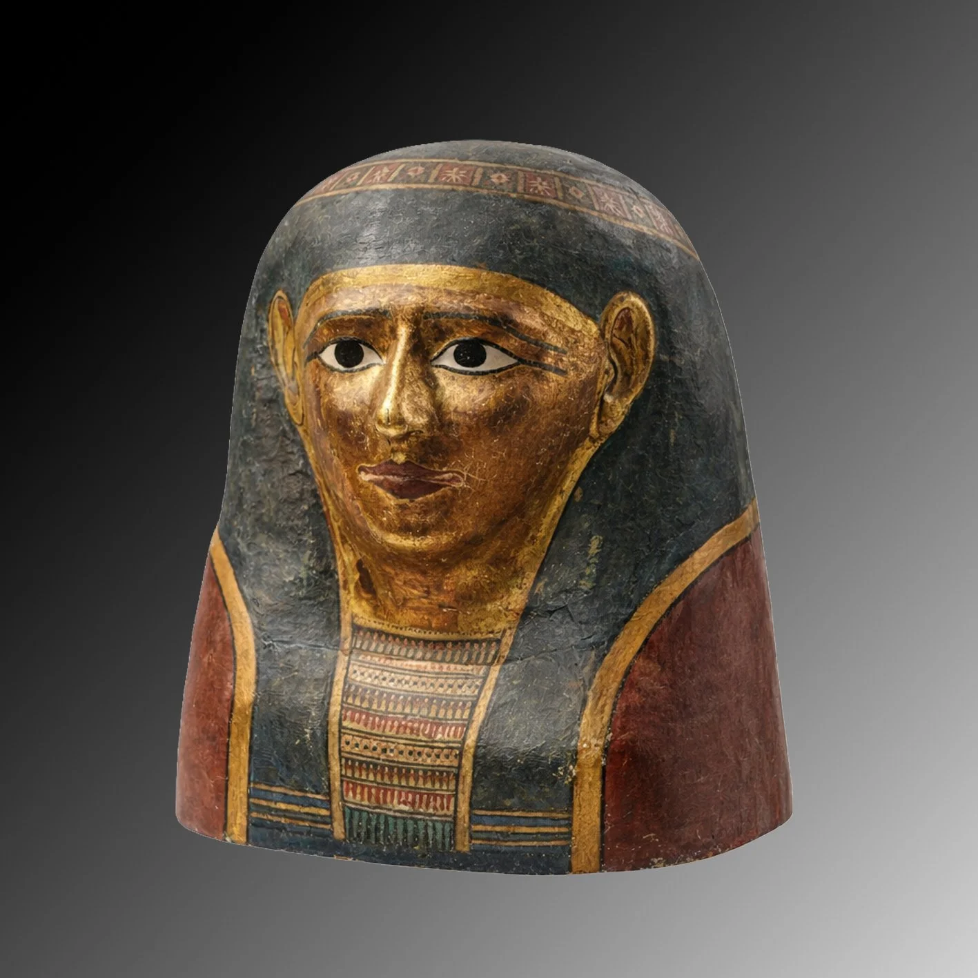 Ancient Egyptian painted funerary mask of a woman with black hair, gold face, and red and blue collar.