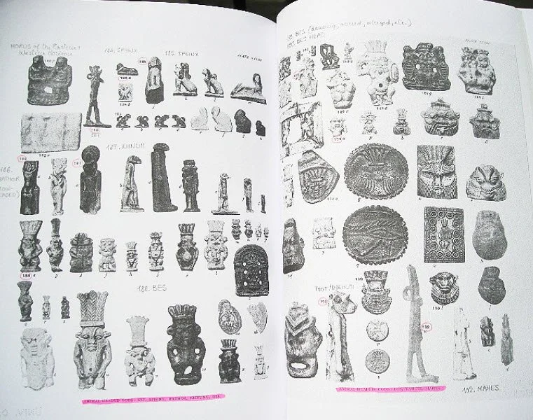 Black and white photos of various ancient artifacts, including figurines, statues, vases, and jewelry, arranged in rows and columns across two pages.