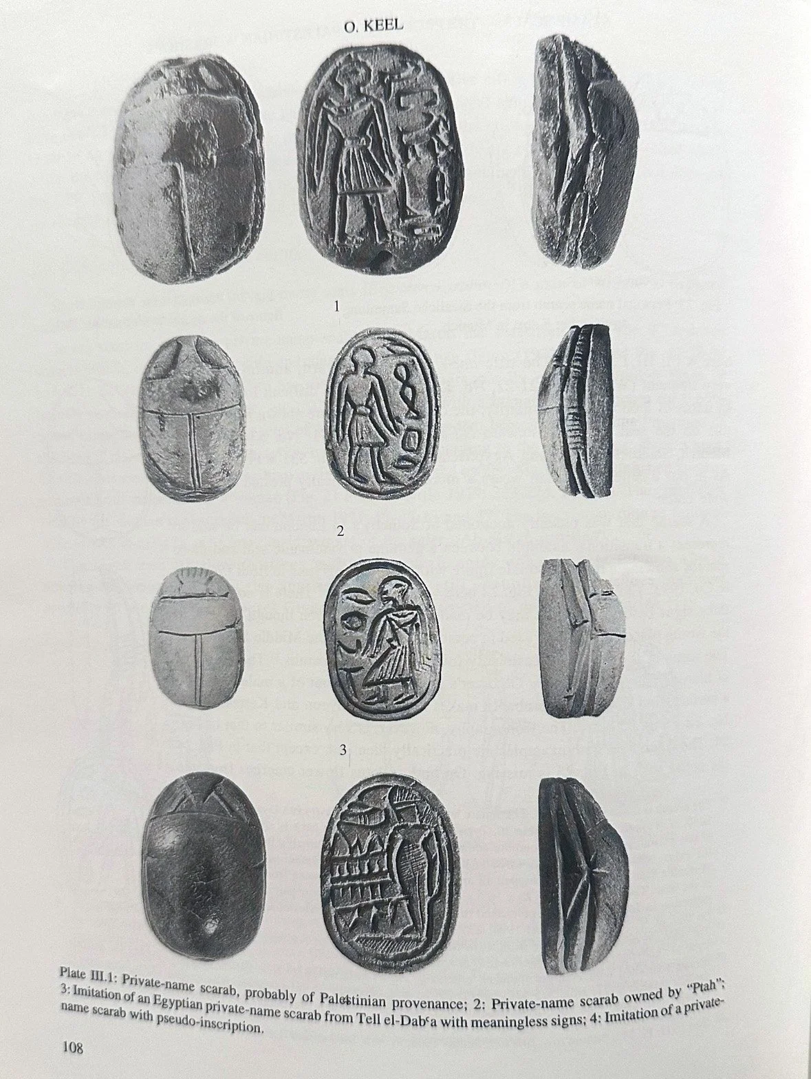 Black and white scientific illustration of four Egyptian scarabs with different carvings and inscriptions, each shown from the front and side angle.