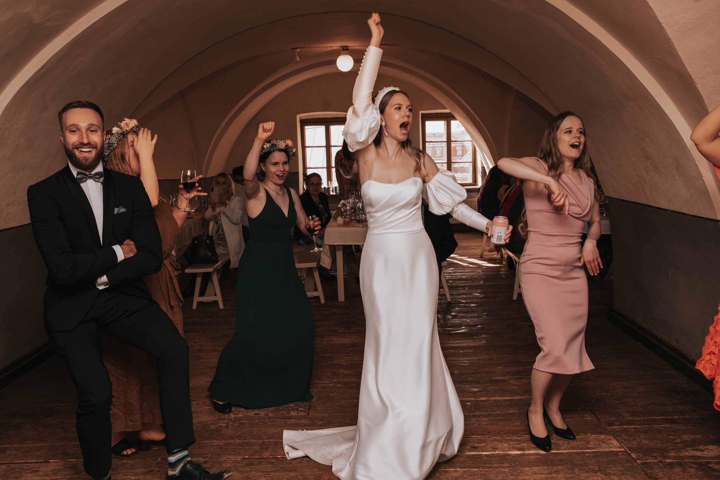 Wedding celebration with bride and guests dancing