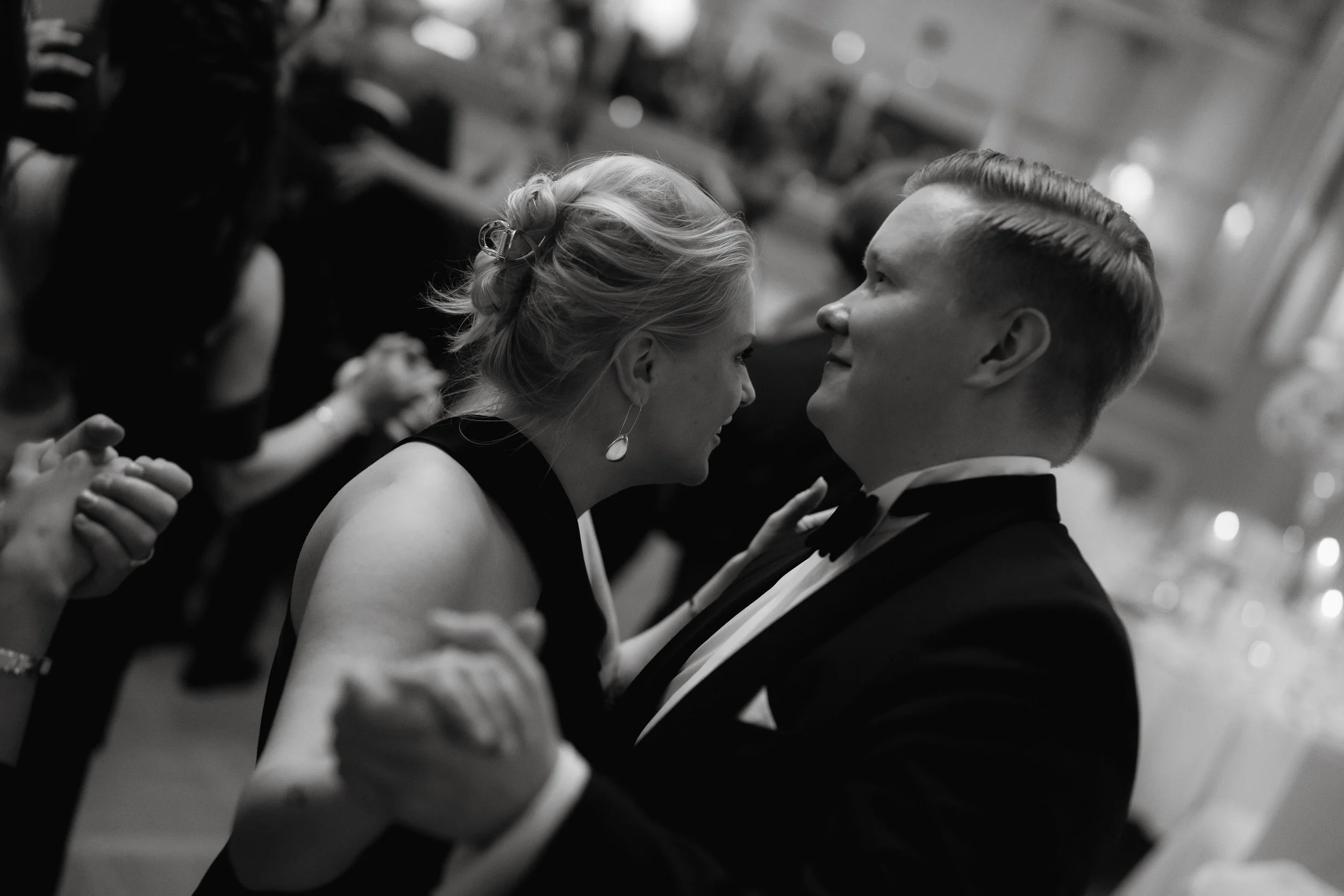 Black and white photo of a couple dancing at a formal event.