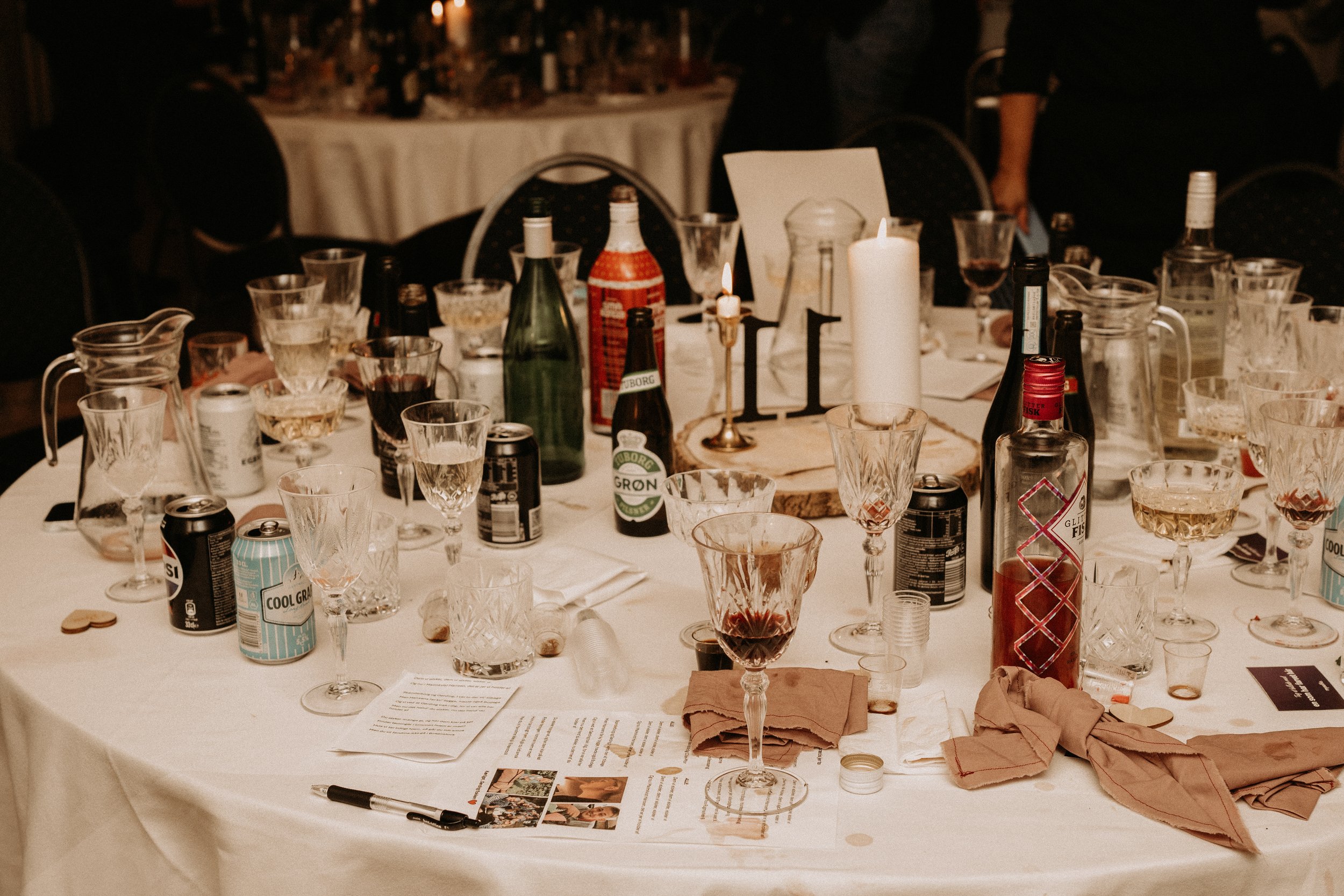 Messy table with drinks and glasses at a party