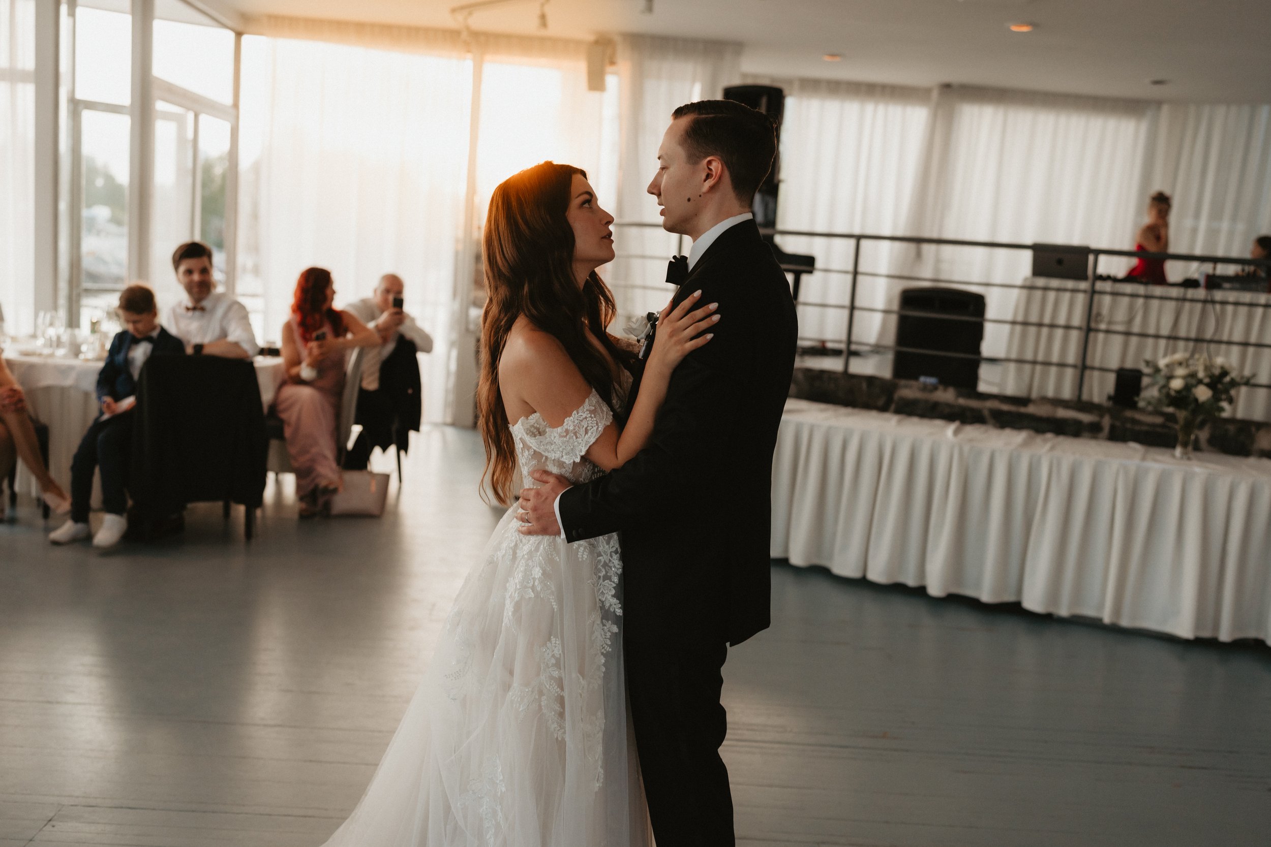 Bride and groom dancing at wedding reception.