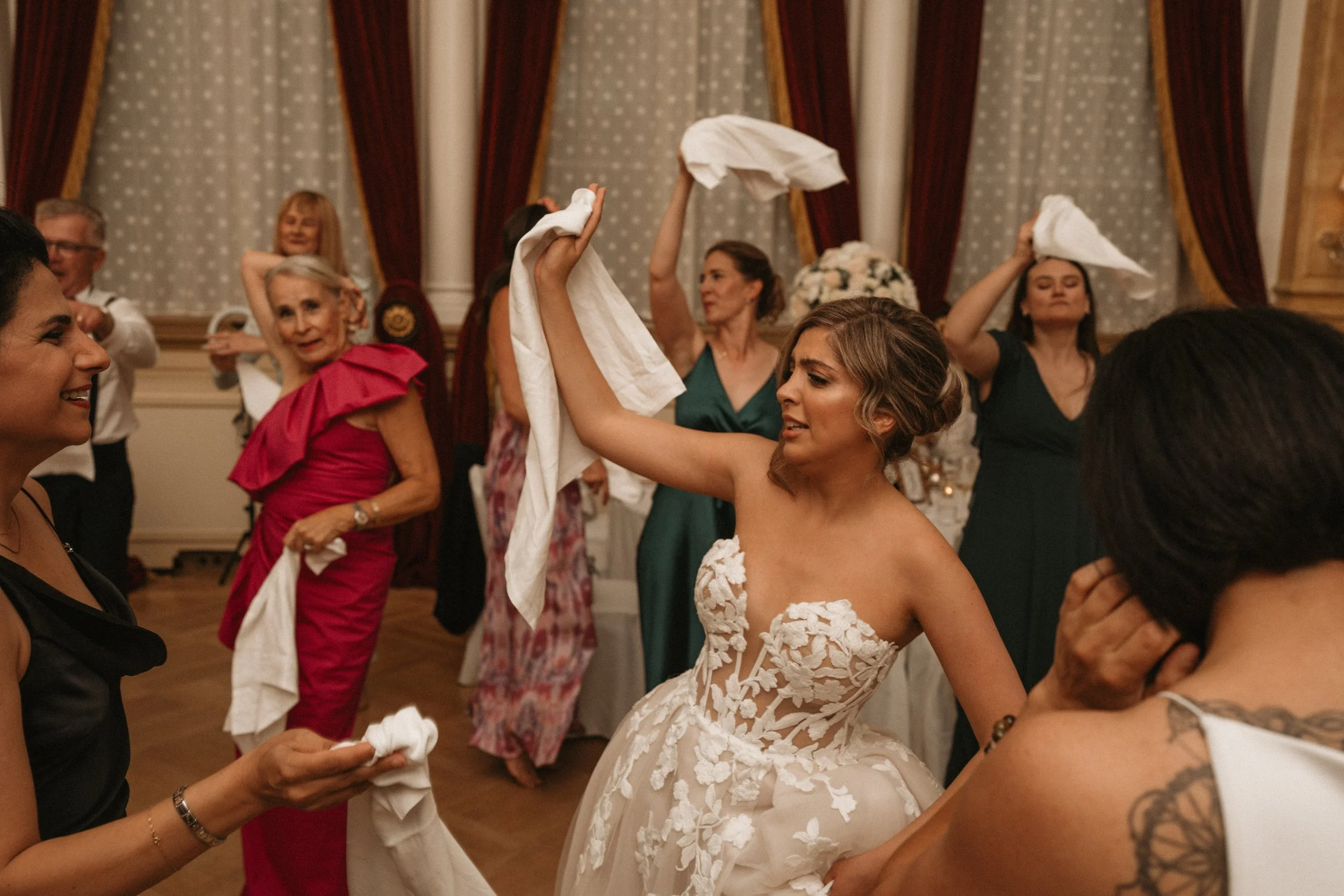Guests dancing with napkins at a wedding reception