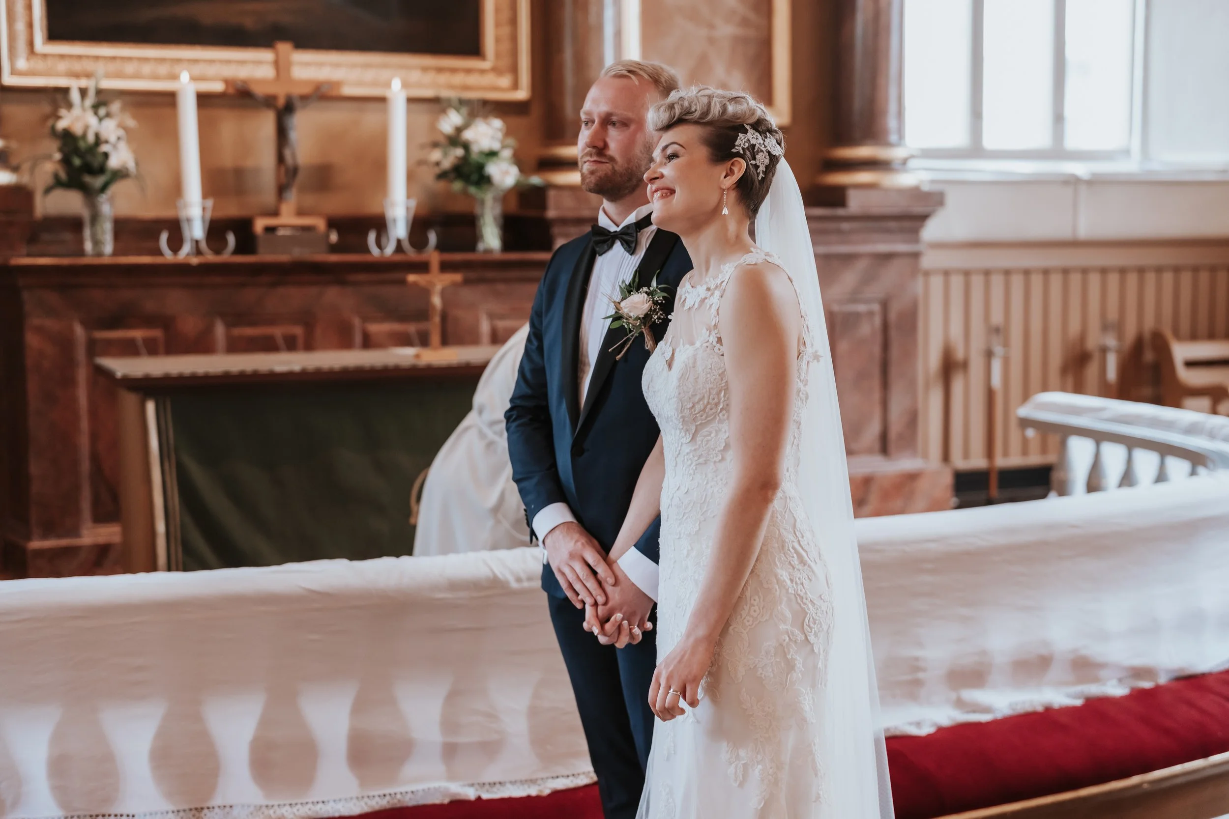 Bride and groom in church during wedding ceremony