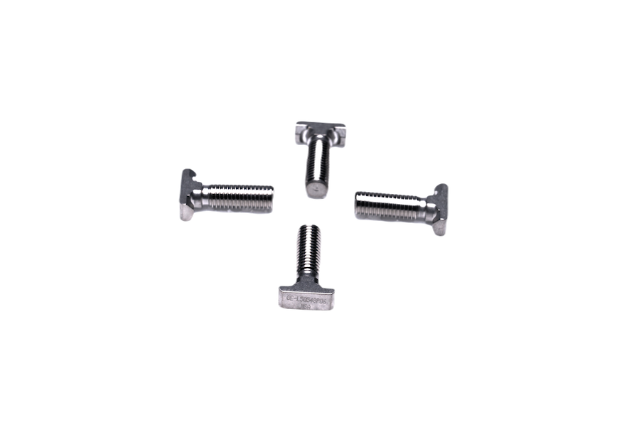 Four metal T-slot bolts arranged in a square pattern on a white background.