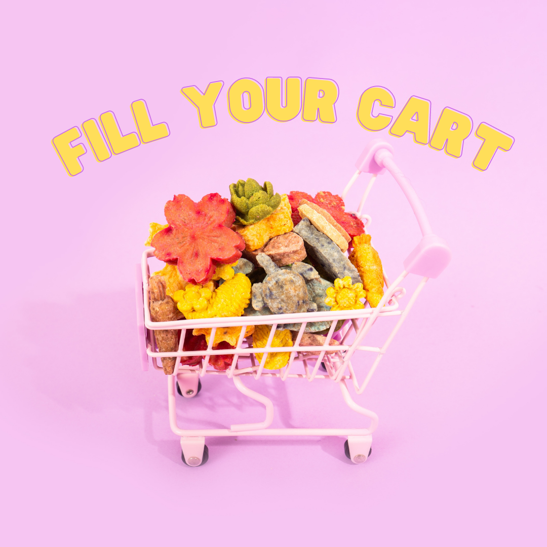Small pink shopping cart filled with colorful rock-shaped candies on a pink background with yellow text that reads 'Fill Your Cart'.