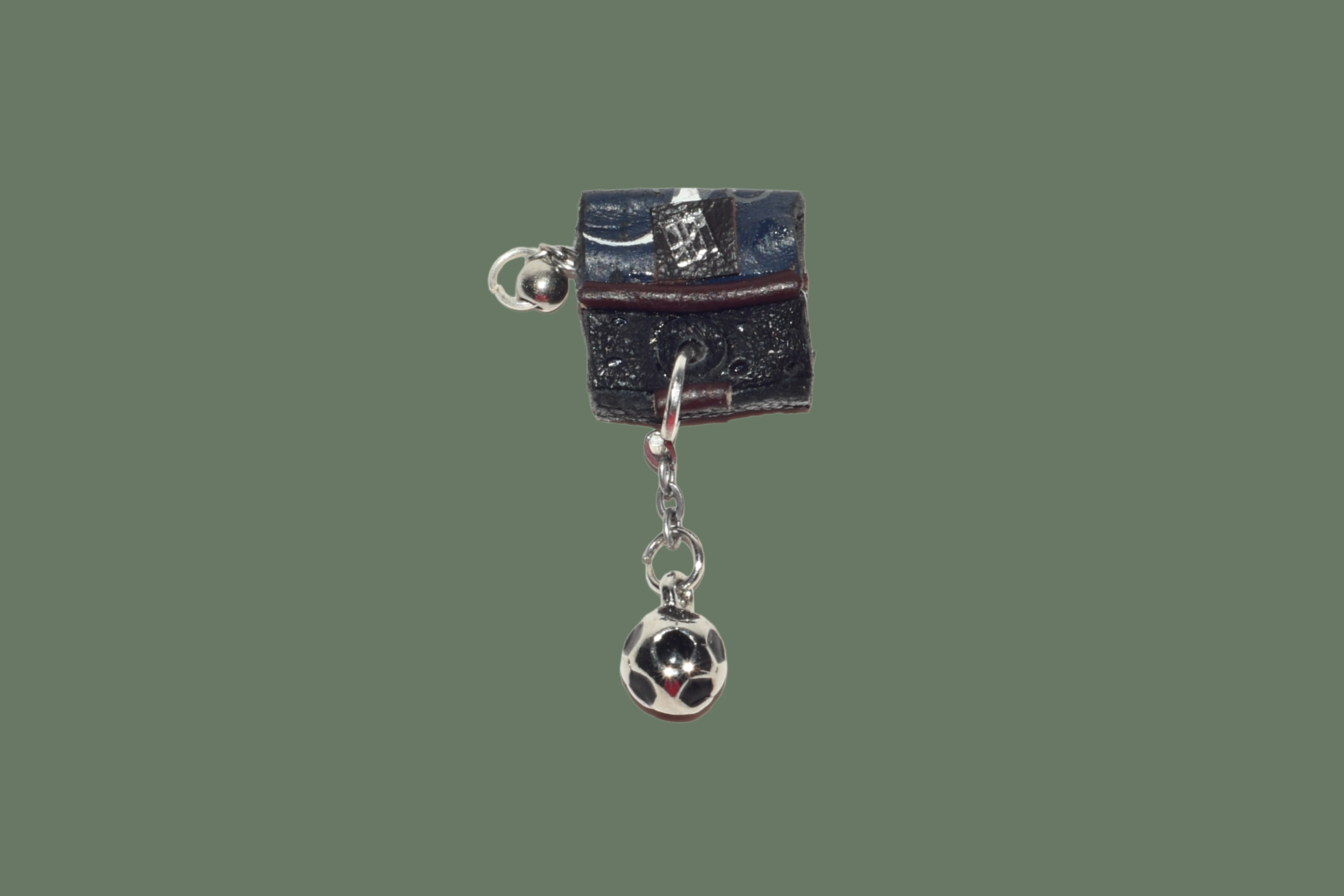 premium dark blue leather from calvin klein shoes.  silver football charm , silver chain
