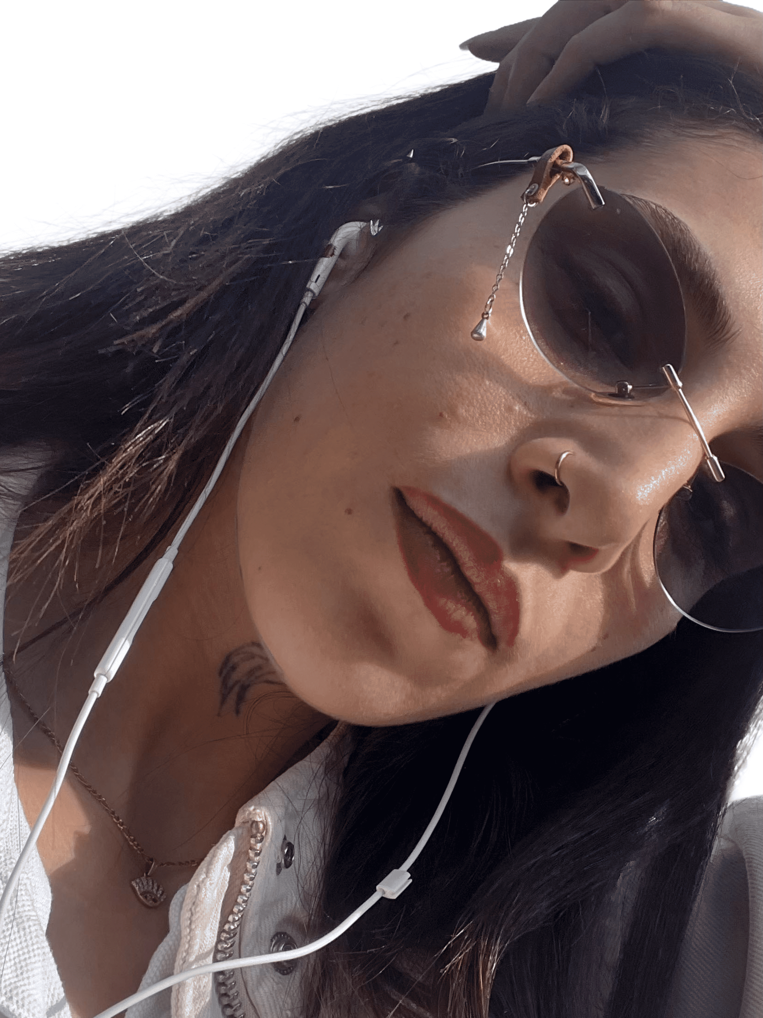 girl wearing a slide on eyeglasses accessory made of silver plated charm attached to organic brown leather holder