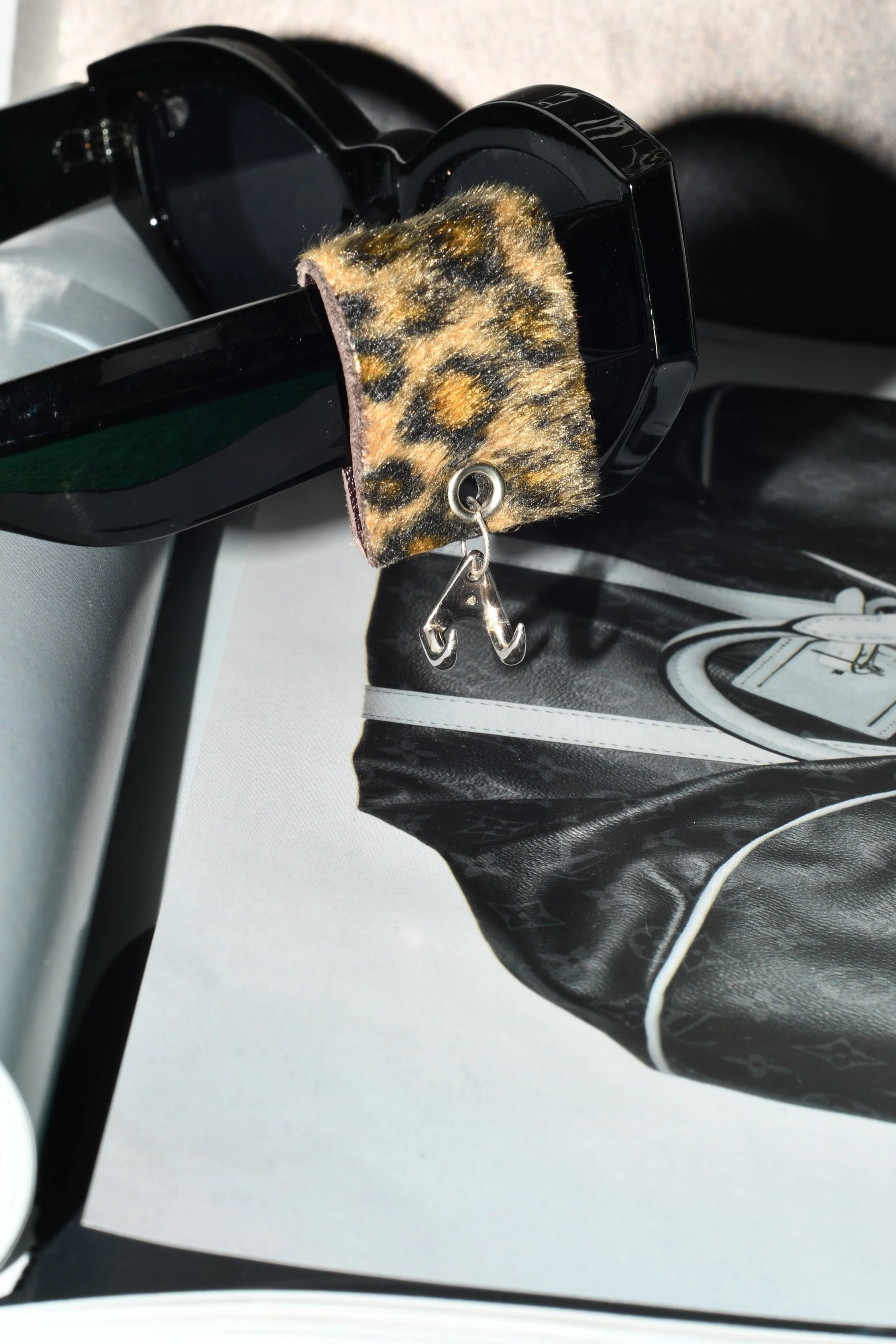 Cheetah fabric patterned  with silver Claw. eyewear accessory
